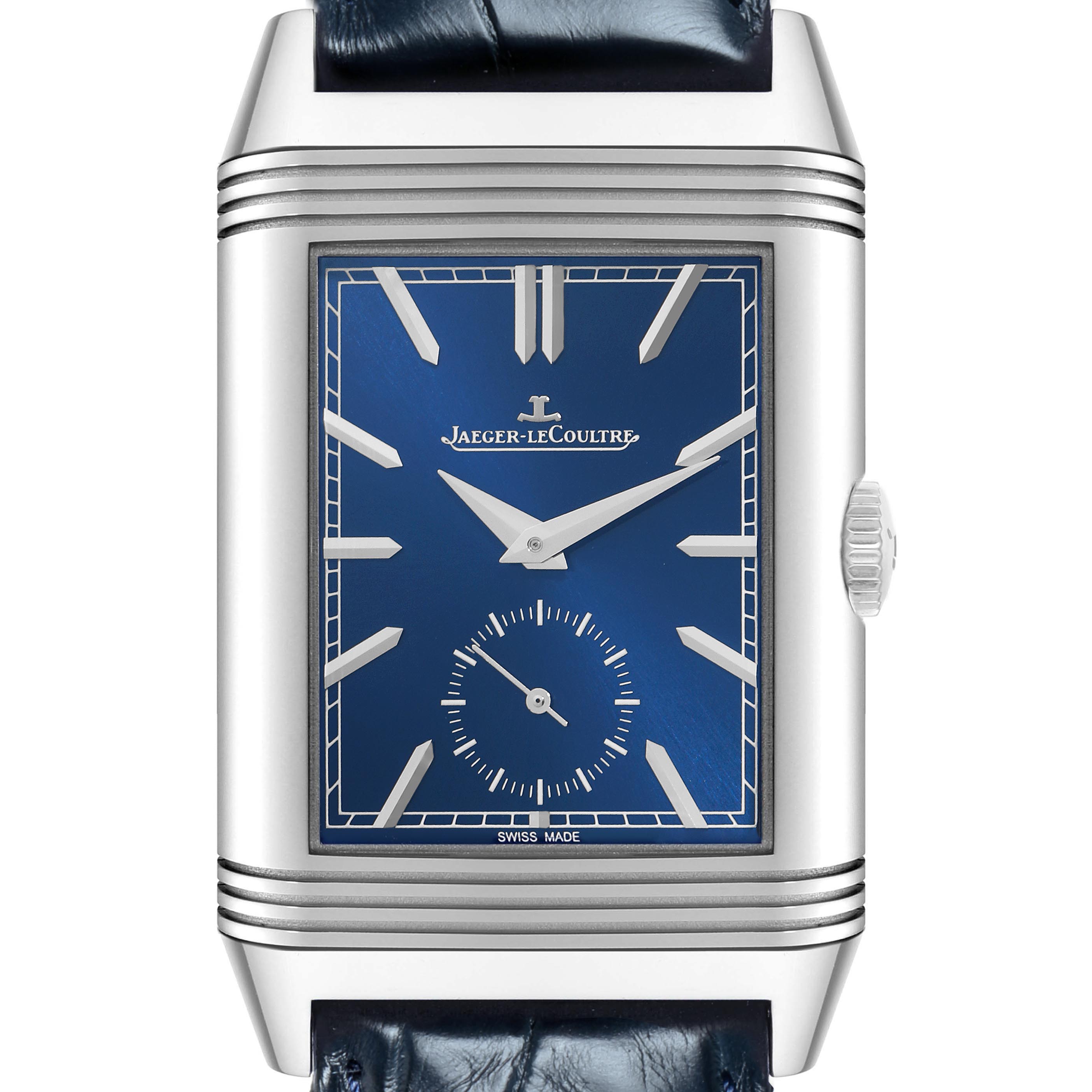 The Jaeger-LeCoultre Reverso watch is shown from a front angle, highlighting its blue dial and silver rectangular case.