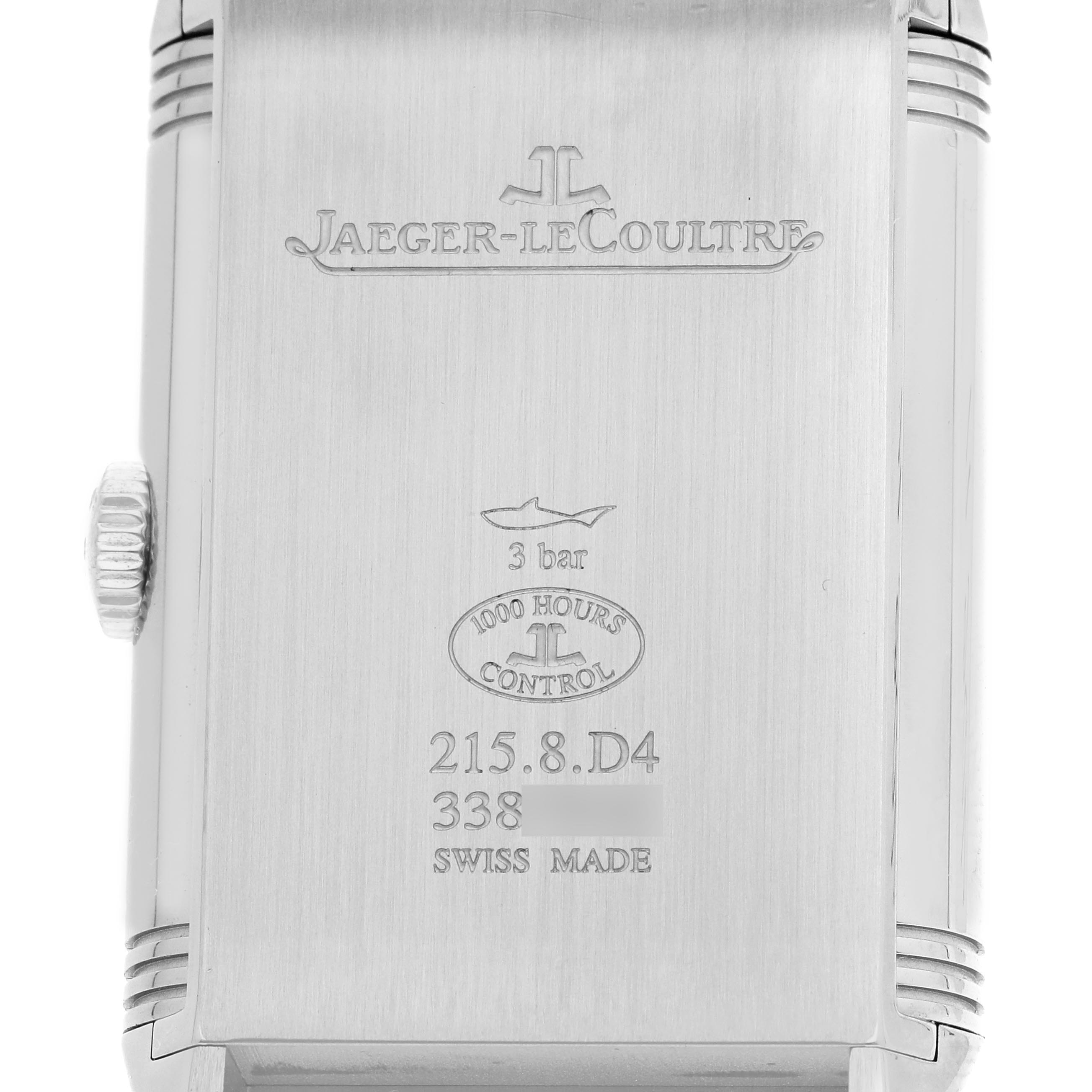 The image shows the back of a Jaeger-LeCoultre Reverso watch, featuring brand engravings and specifications.