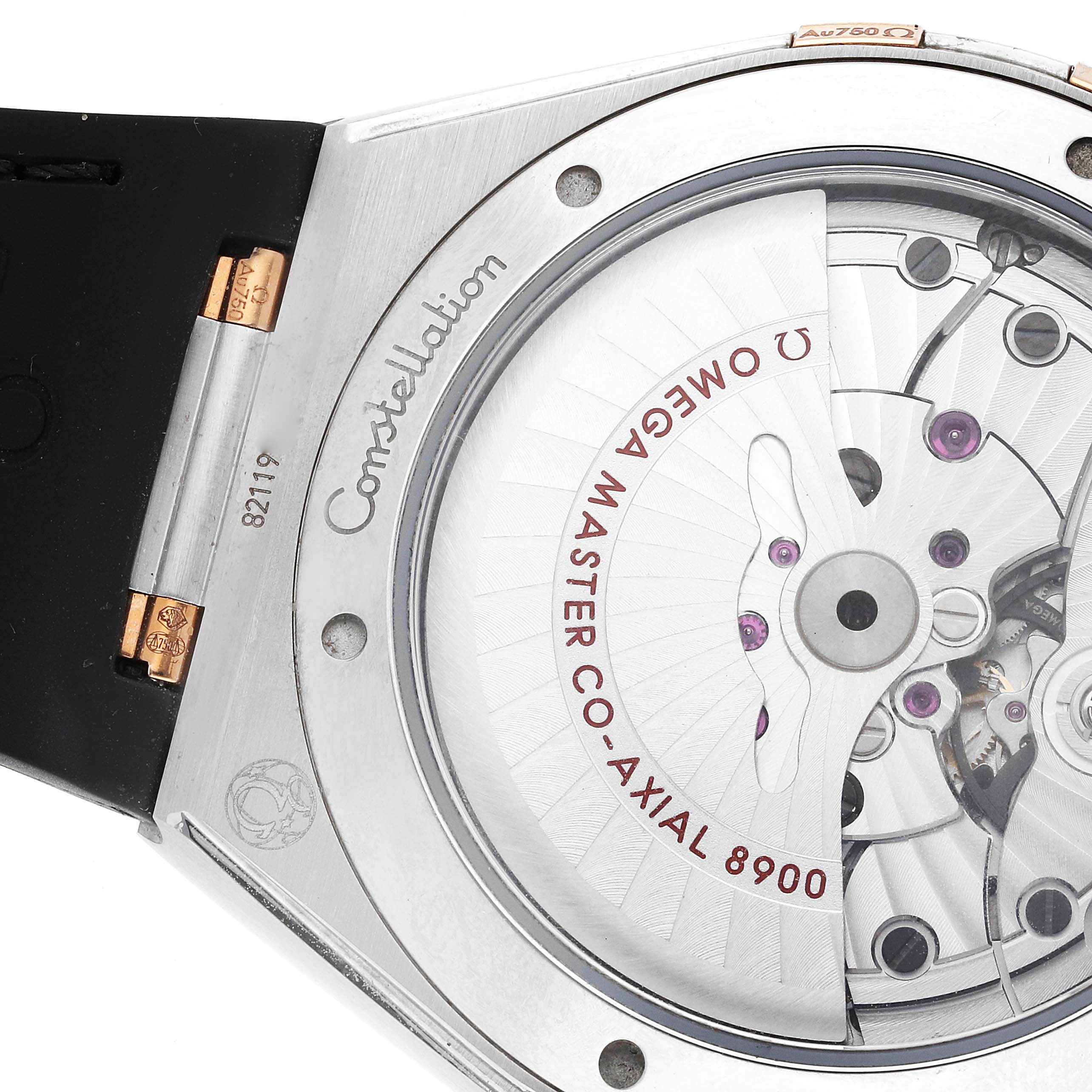 This image shows a close-up of the back of an Omega Constellation 131.23.41.21.06.001 Men's Steel and Gold (two tone) Grey Dial 131.23.41.21.06.001 Men's Steel and Gold (two tone) Grey Dial watch, highlighting the movement and branding.