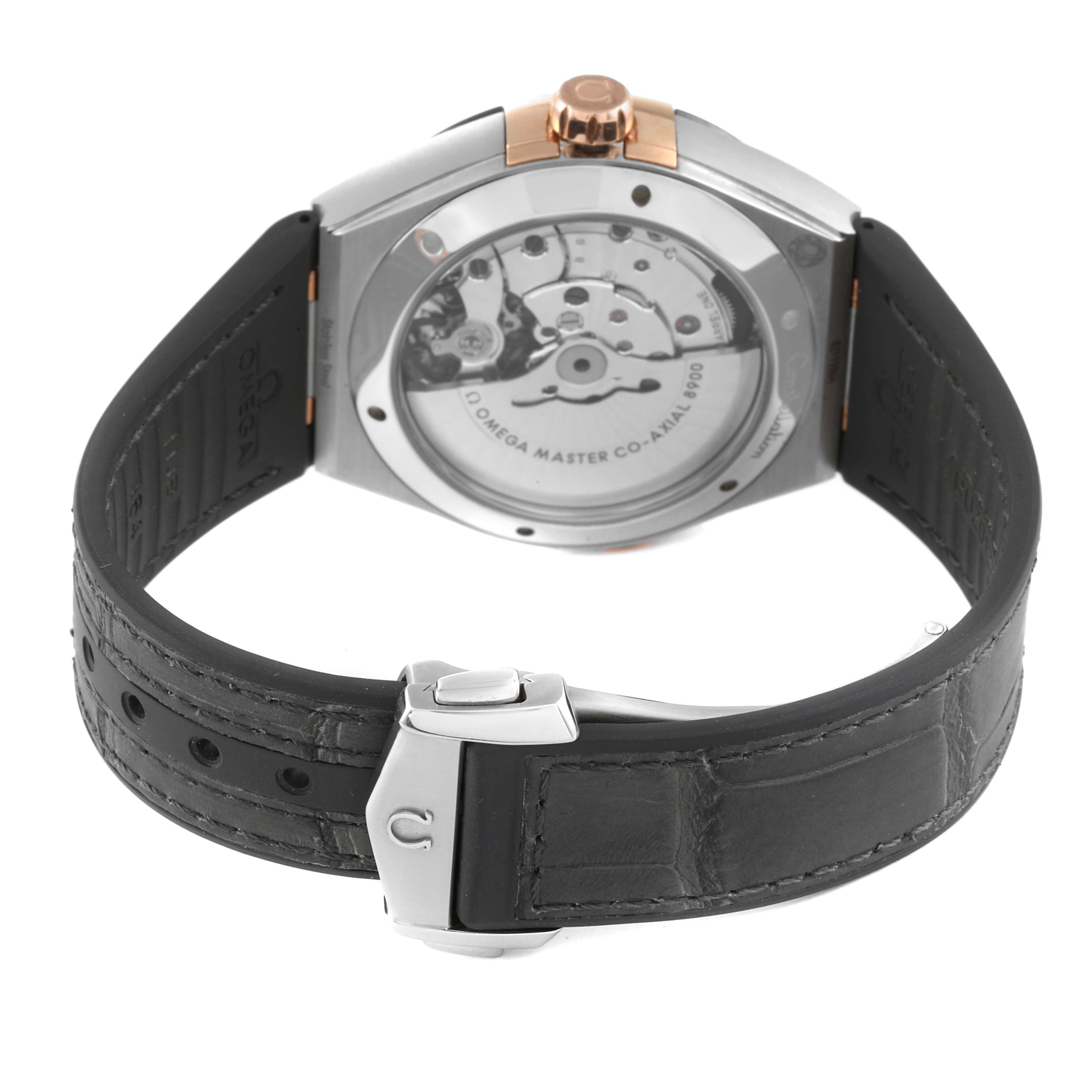 The image shows the back view of an Omega Constellation 131.23.41.21.06.001 Men's Steel and Gold (two tone) Grey Dial 131.23.41.21.06.001 Men's Steel and Gold (two tone) Grey Dial watch, highlighting its movement and leather strap.