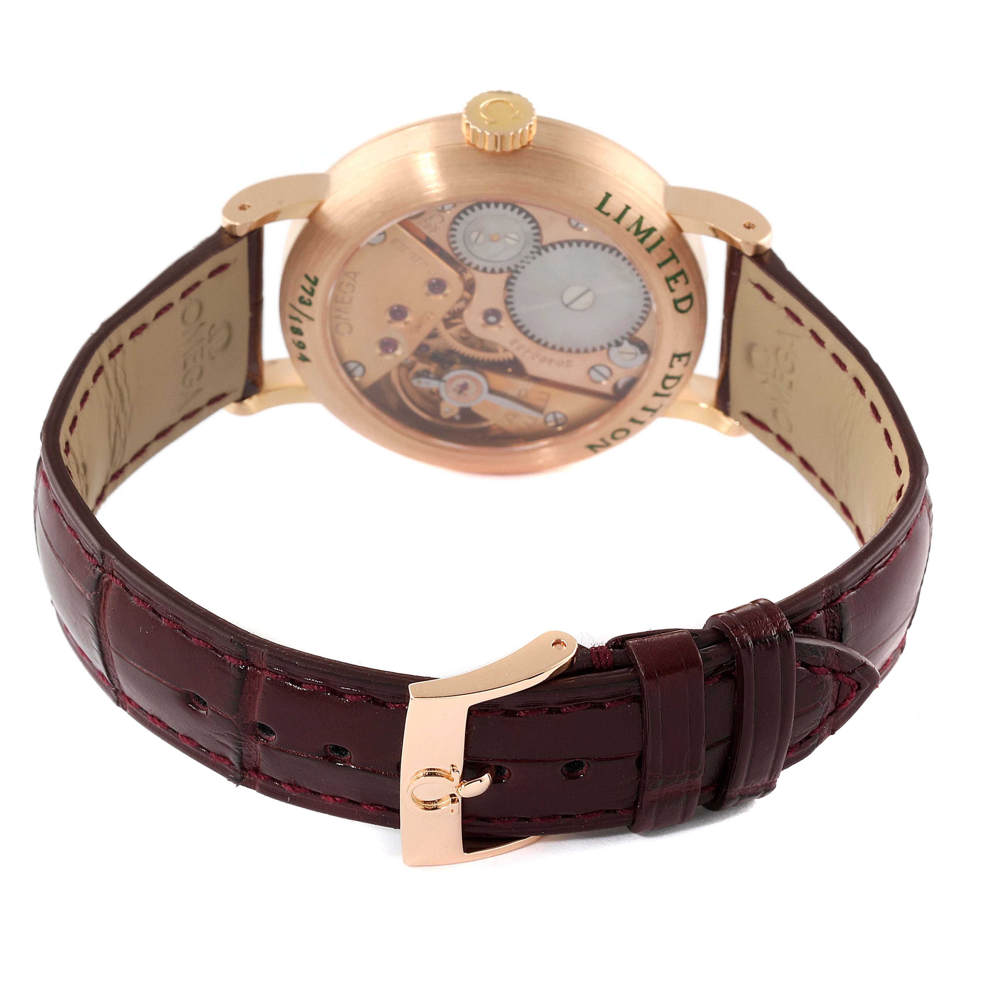 The image shows the back view of the Omega Museum 5950.30.03 Men's Rose Gold Brown Dial 5950.30.03 Men's Rose Gold Brown Dial model watch, displaying its mechanical components and the leather strap with the buckle.