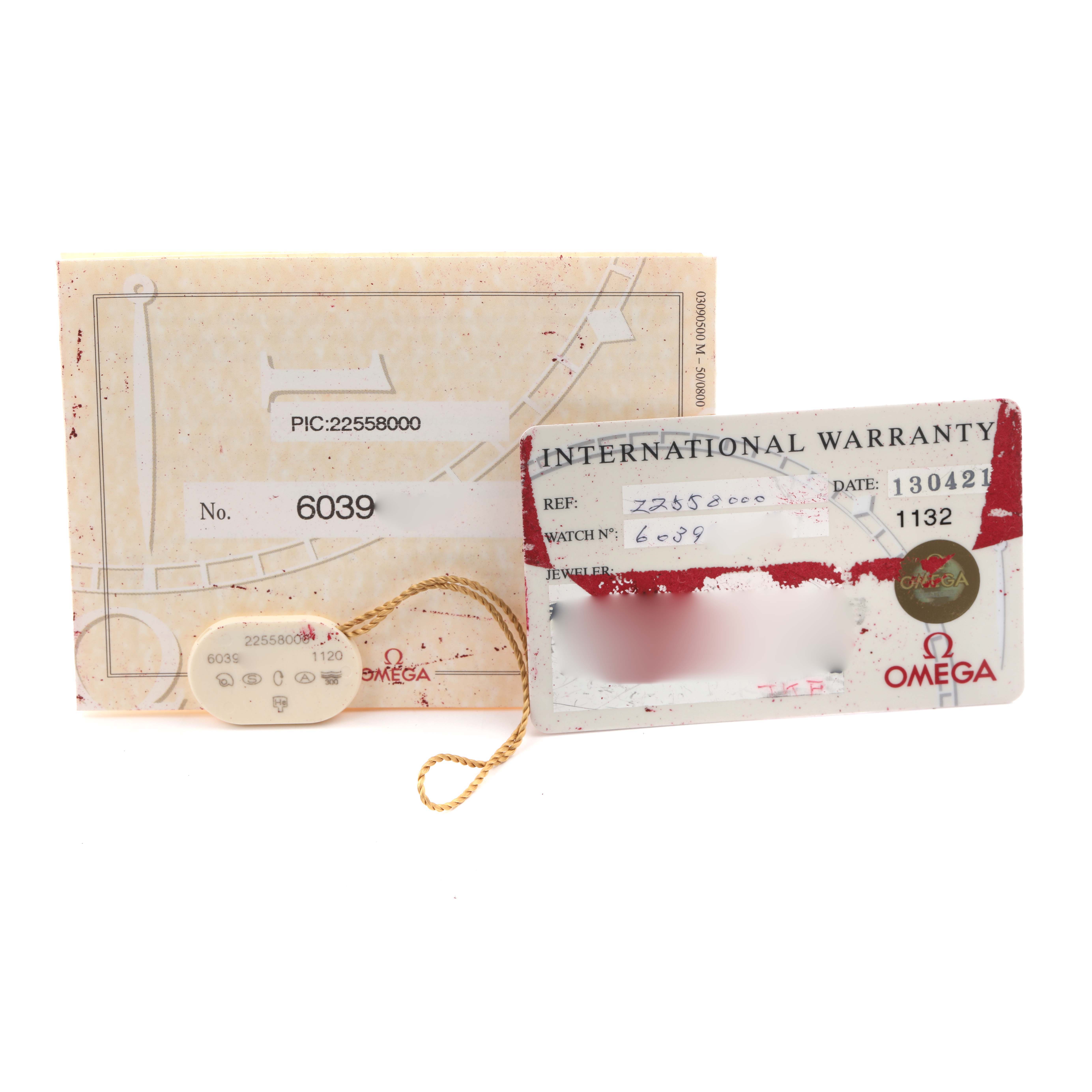 The image shows the warranty card and documentation for an Omega Seamaster 2255.80.00 Men's Stainless Steel Blue Dial 2255.80.00 Men's Stainless Steel Blue Dial watch, including a tag and booklet.