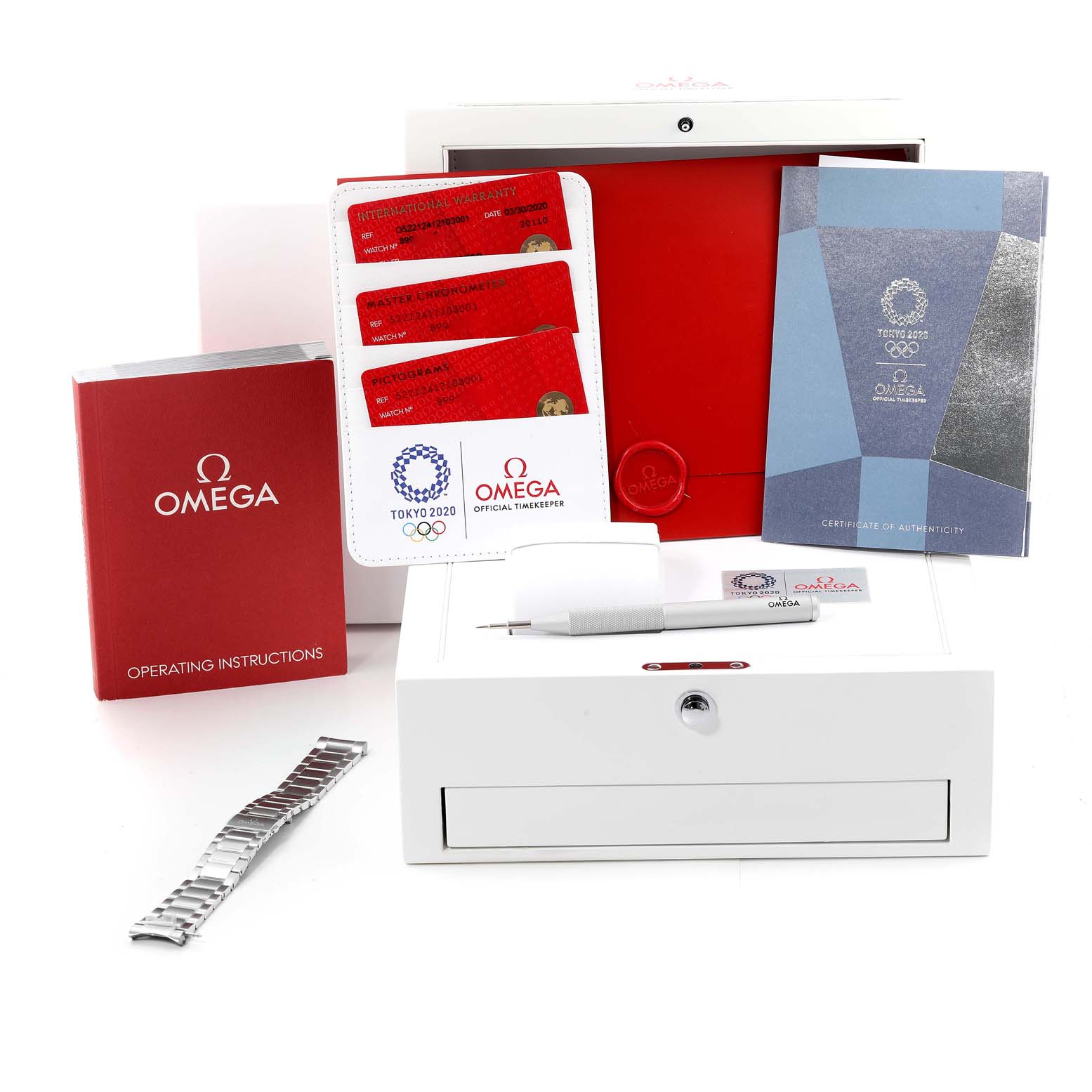 The image shows the accessories and packaging of the Omega Aqua Terra 522.12.41.21.03.001 Men's Stainless Steel Blue Dial 522.12.41.21.03.001 Men's Stainless Steel Blue Dial model, including manuals, warranty cards, a tool, and an extra bracelet.