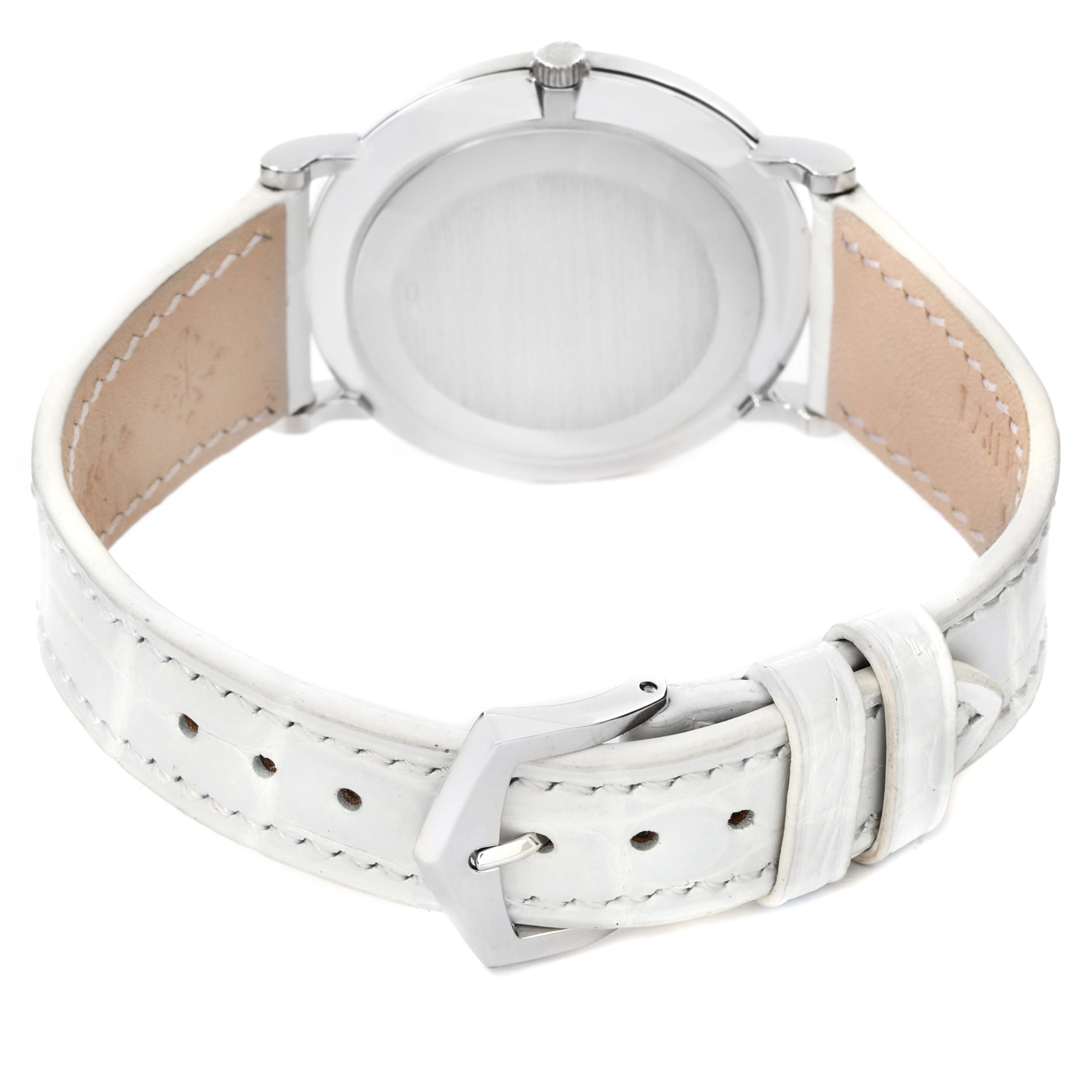 The image shows the back view of a Patek Philippe Calatrava 3919G Men's White Gold White Dial 3919G Men's White Gold White Dial watch, highlighting its white leather strap and buckle.