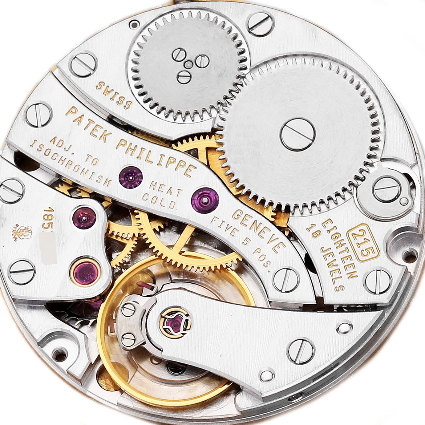 The image shows a top-down view of the Calatrava movement by Patek Philippe, highlighting gears and jewels.
