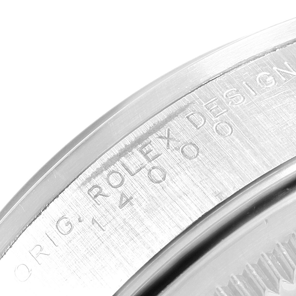 The image shows an up-close view of the engraved bezel edge of a Rolex Air-King 14000 Men's Stainless Steel Blue Dial 14000 Men's Stainless Steel Blue Dial watch.