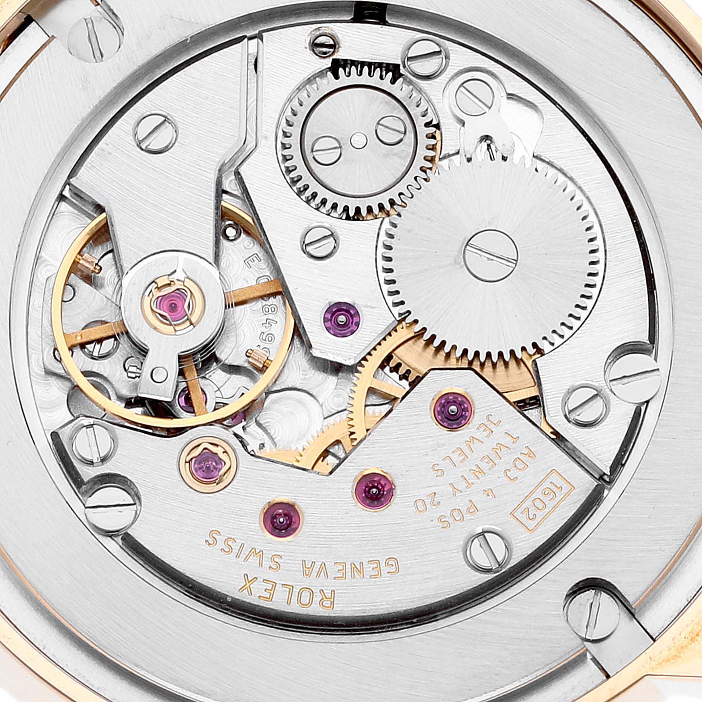 This is a close-up view of the movement mechanism of a Rolex Cellini 5115 Men's Yellow Gold Beige Dial 5115 Men's Yellow Gold Beige Dial watch, revealing gears and inscriptions.