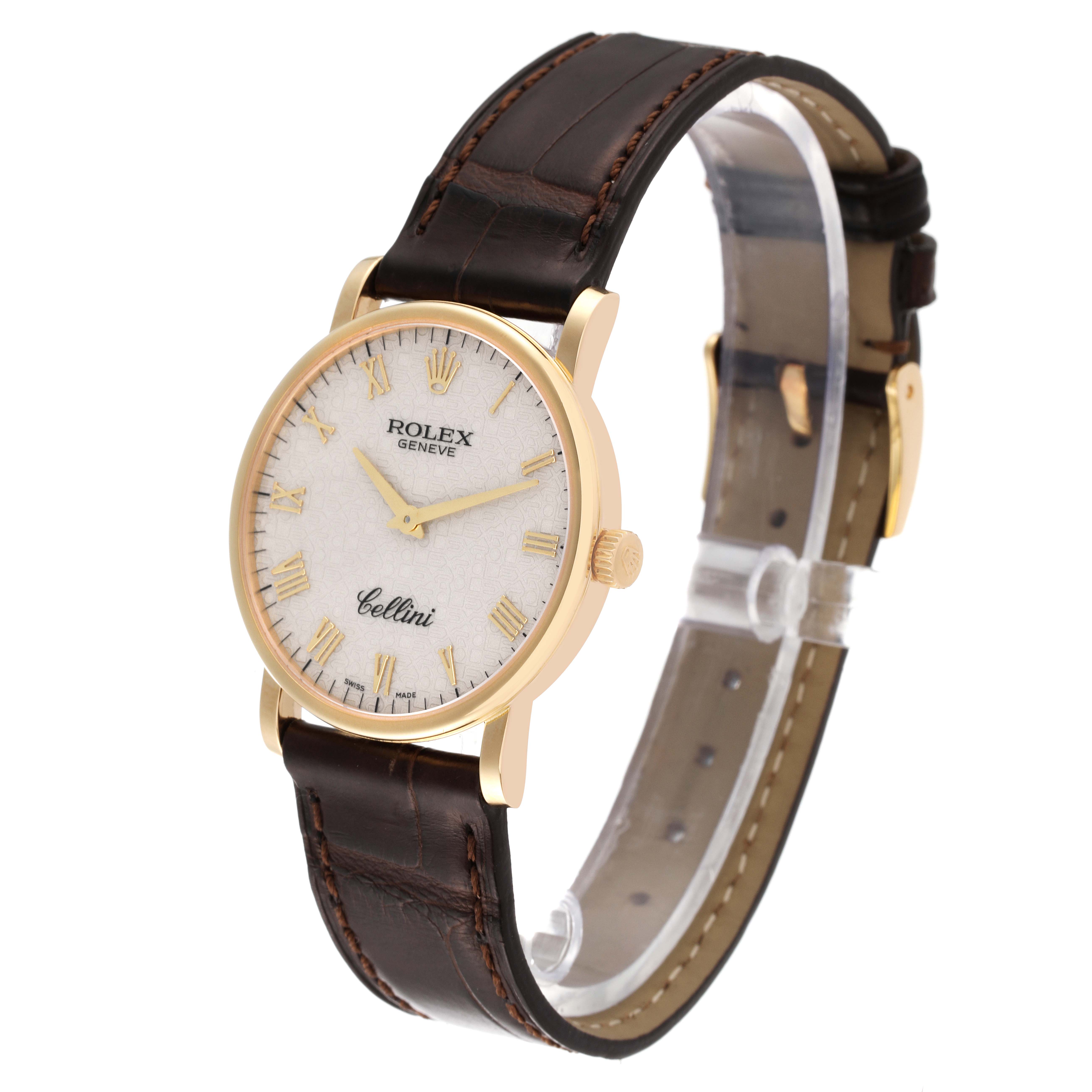 The Rolex Cellini 5115 Men's Yellow Gold Beige Dial 5115 Men's Yellow Gold Beige Dial watch is shown at a slight angle, displaying its gold case, white dial, brown leather strap, and crown.