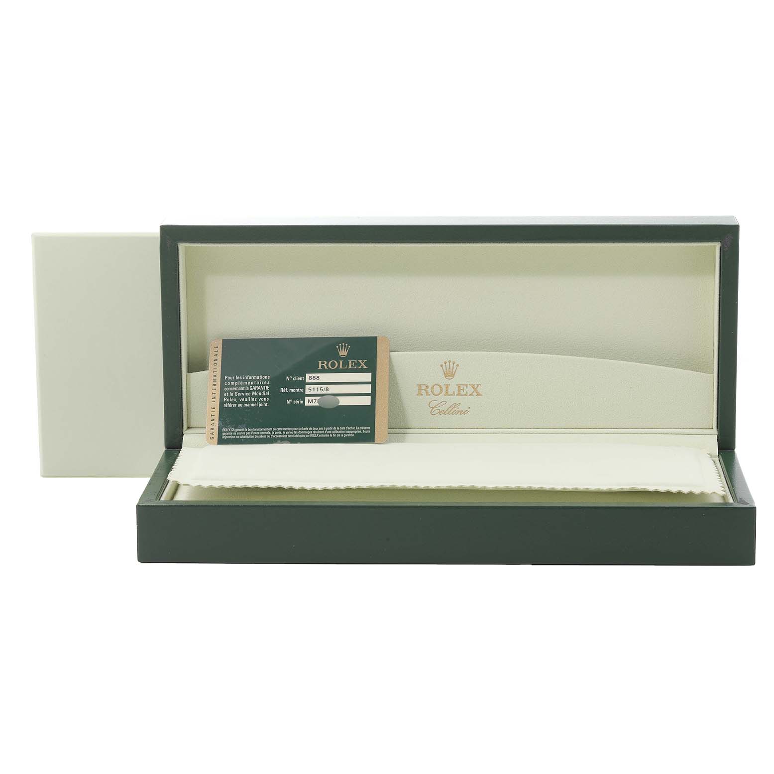 This image shows an open Rolex Cellini 5115 Men's Yellow Gold Beige Dial 5115 Men's Yellow Gold Beige Dial watch box containing a warranty card and a cleaning cloth.