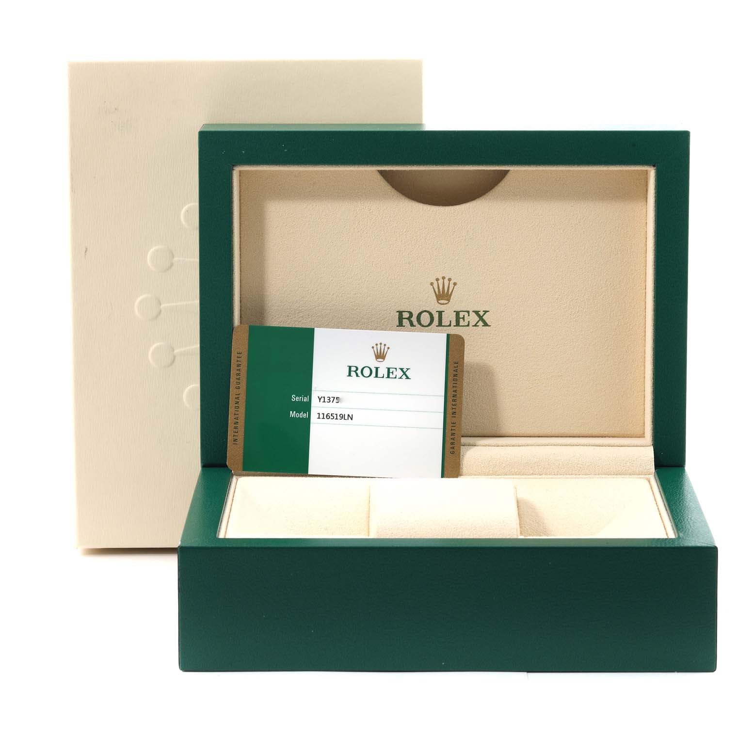 This image shows an open Rolex box for the Daytona model with a warranty card placed inside.