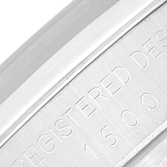 The image shows a close-up view of the case back engraving on a Vintage Collection model by Rolex.