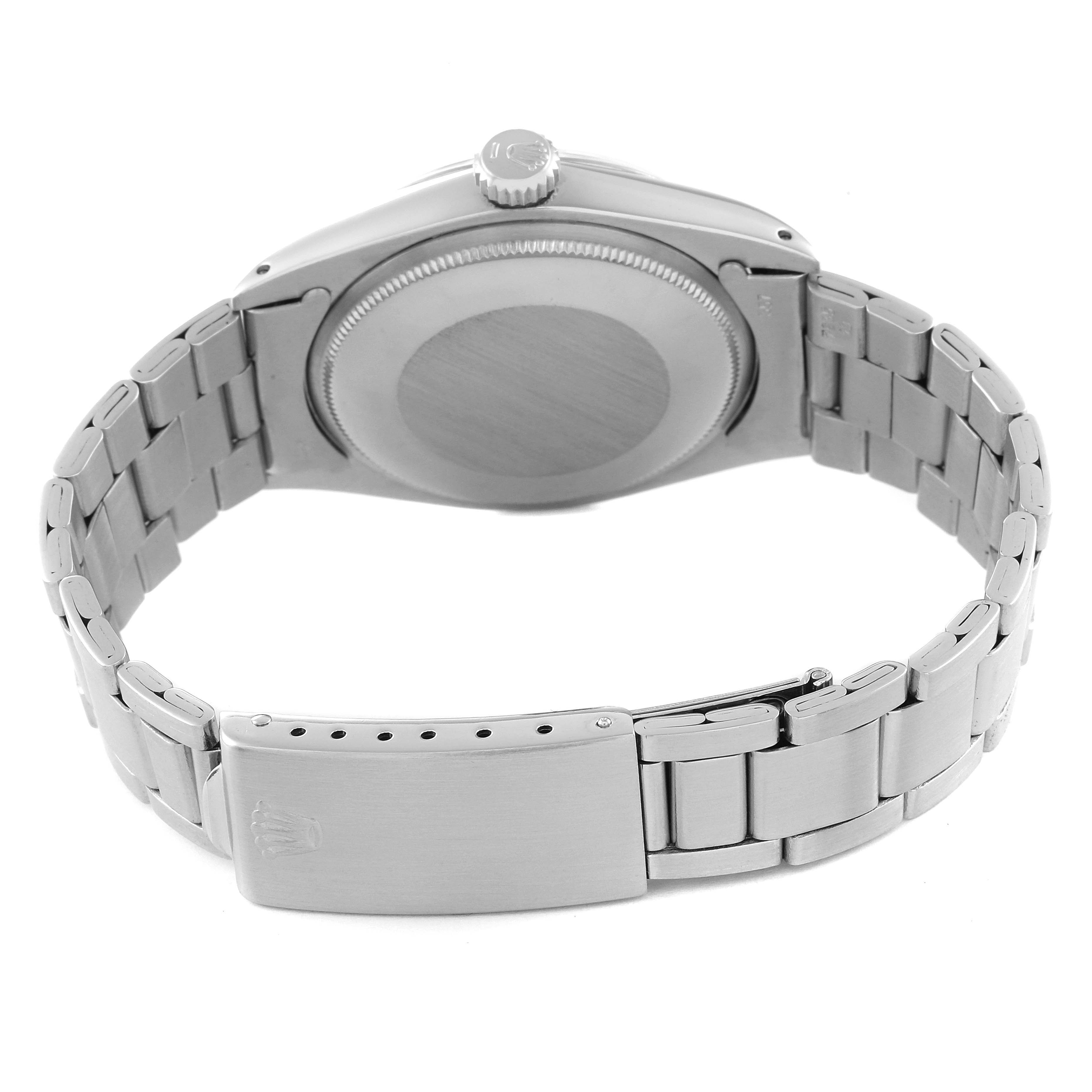 The image shows the back view of a Rolex Vintage Collection 1500 Men's Stainless Steel Silver Dial 1500 Men's Stainless Steel Silver Dial watch, highlighting the case back, crown, and metal bracelet with clasp.