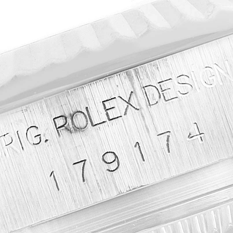 The image shows a close-up of the engraving on the case side of a Rolex Datejust 179174 Women's Stainless Steel Mother of Pearl Dial 179174 Women's Stainless Steel Mother of Pearl Dial watch, highlighting the brand and model number.