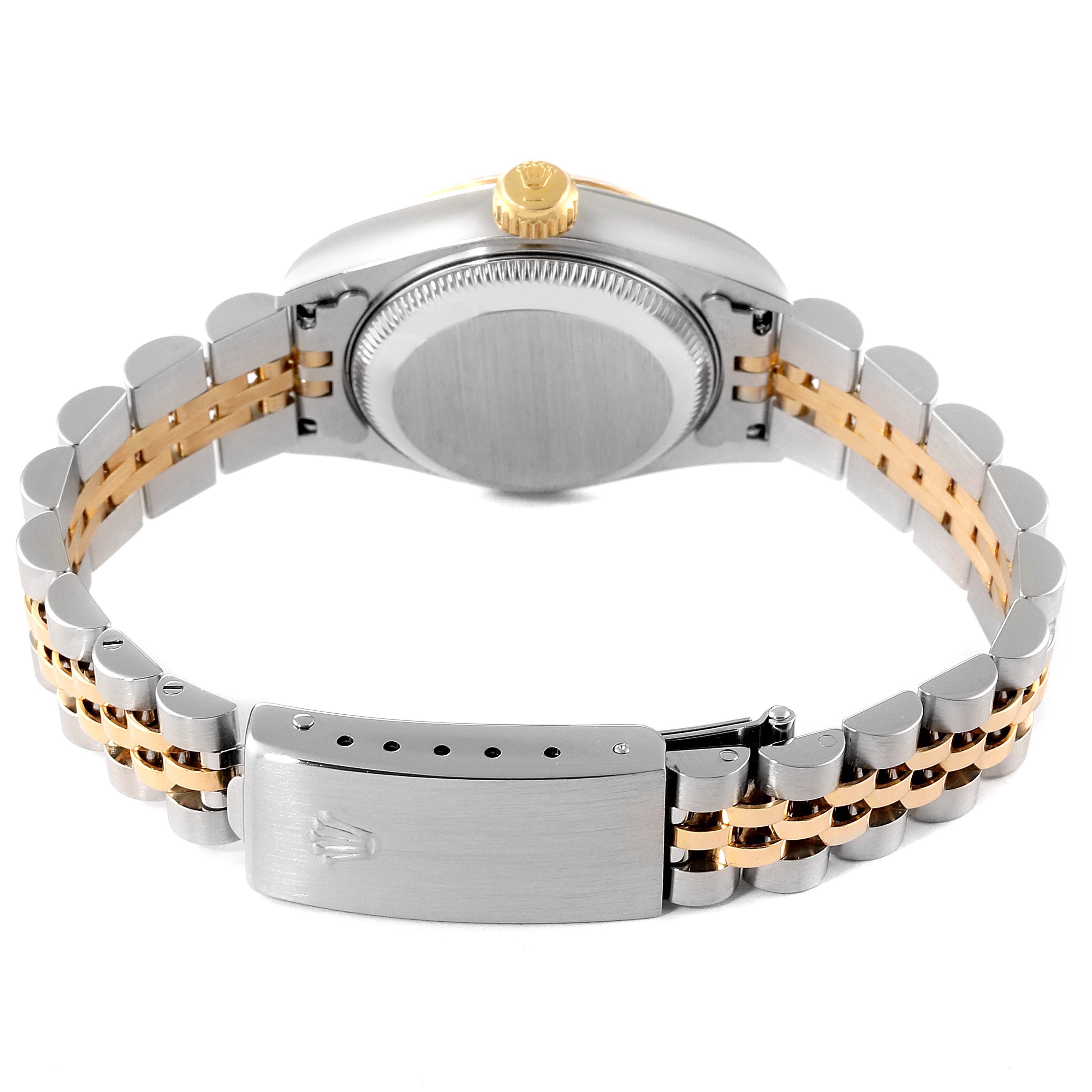 This image shows the back of a Rolex Datejust 69173 Women's Steel and Gold (two tone) White Dial 69173 Women's Steel and Gold (two tone) White Dial, highlighting its clasp, bracelet, and crown from a low angle.