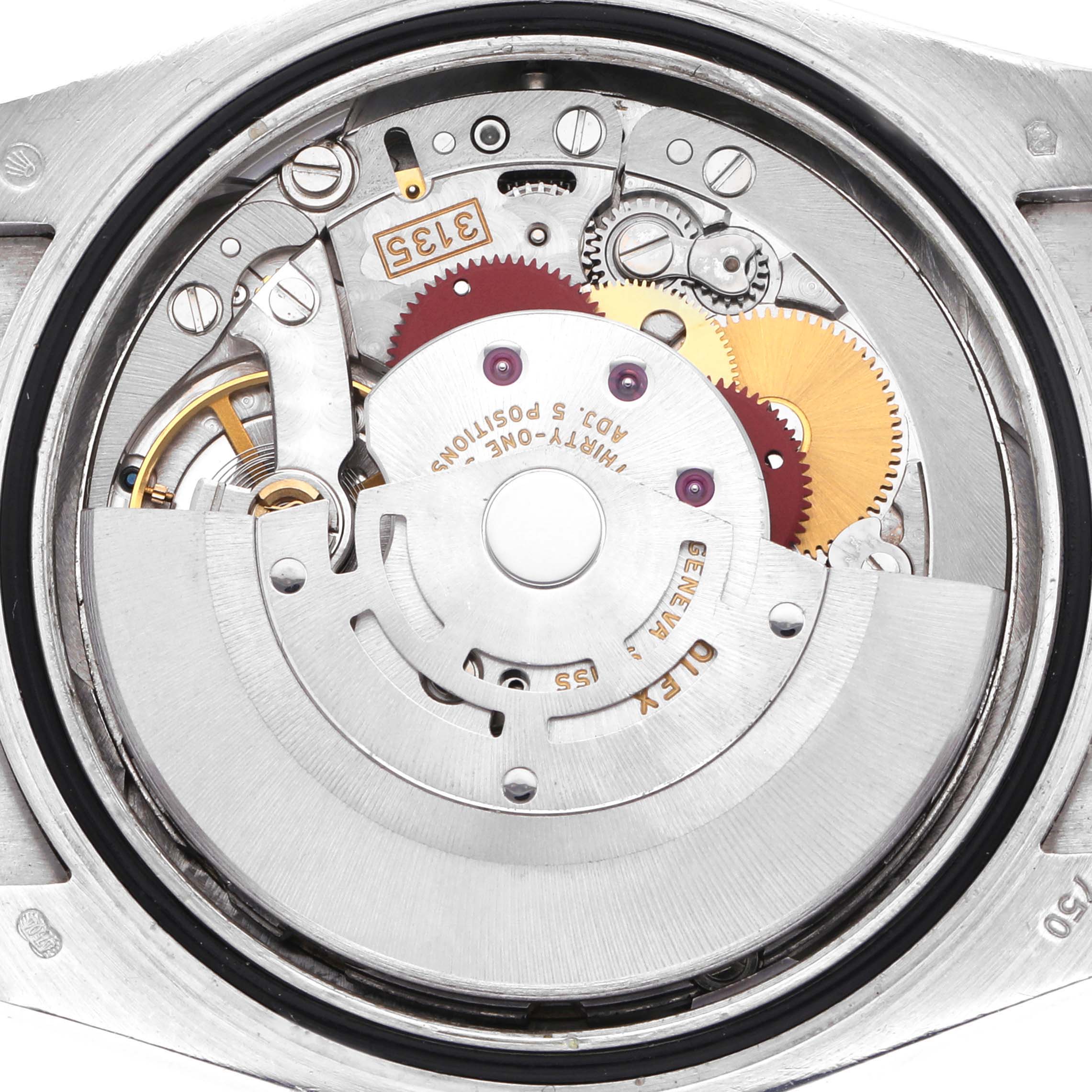 The image shows the movement mechanism of a Rolex Datejust 116139 Men
s White Gold Blue Dial 116139 Men
s White Gold Blue Dial watch from the back, highlighting gears and components.