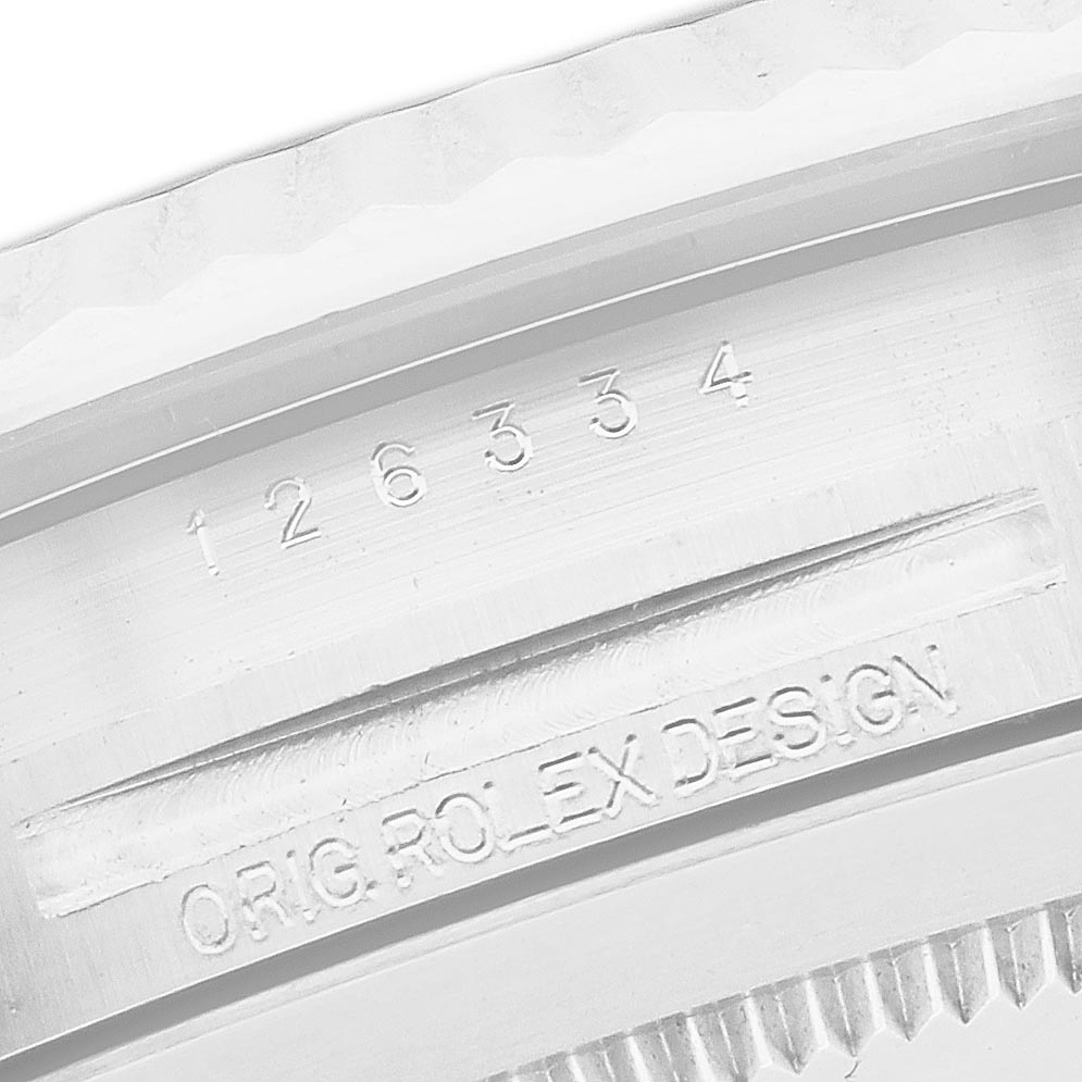 The image shows a close-up of the inner bezel of a Rolex Datejust 41 126334 Men
s Stainless Steel Mother of Pearl Dial 126334 Men
s Stainless Steel Mother of Pearl Dial, highlighting the model number and "Orig. Rolex Design" engraving.