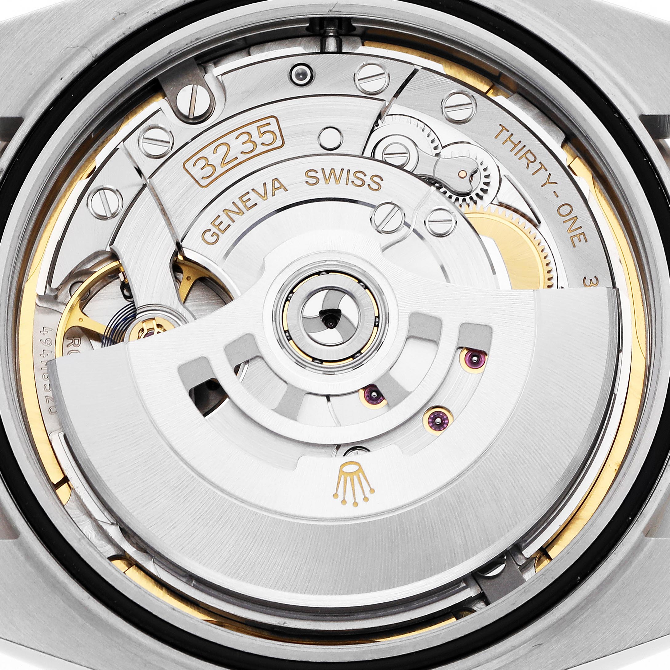 The image shows the movement of a Rolex Datejust 41 126334 Men
s Stainless Steel Mother of Pearl Dial 126334 Men
s Stainless Steel Mother of Pearl Dial from the back, highlighting the rotor and intricate components.