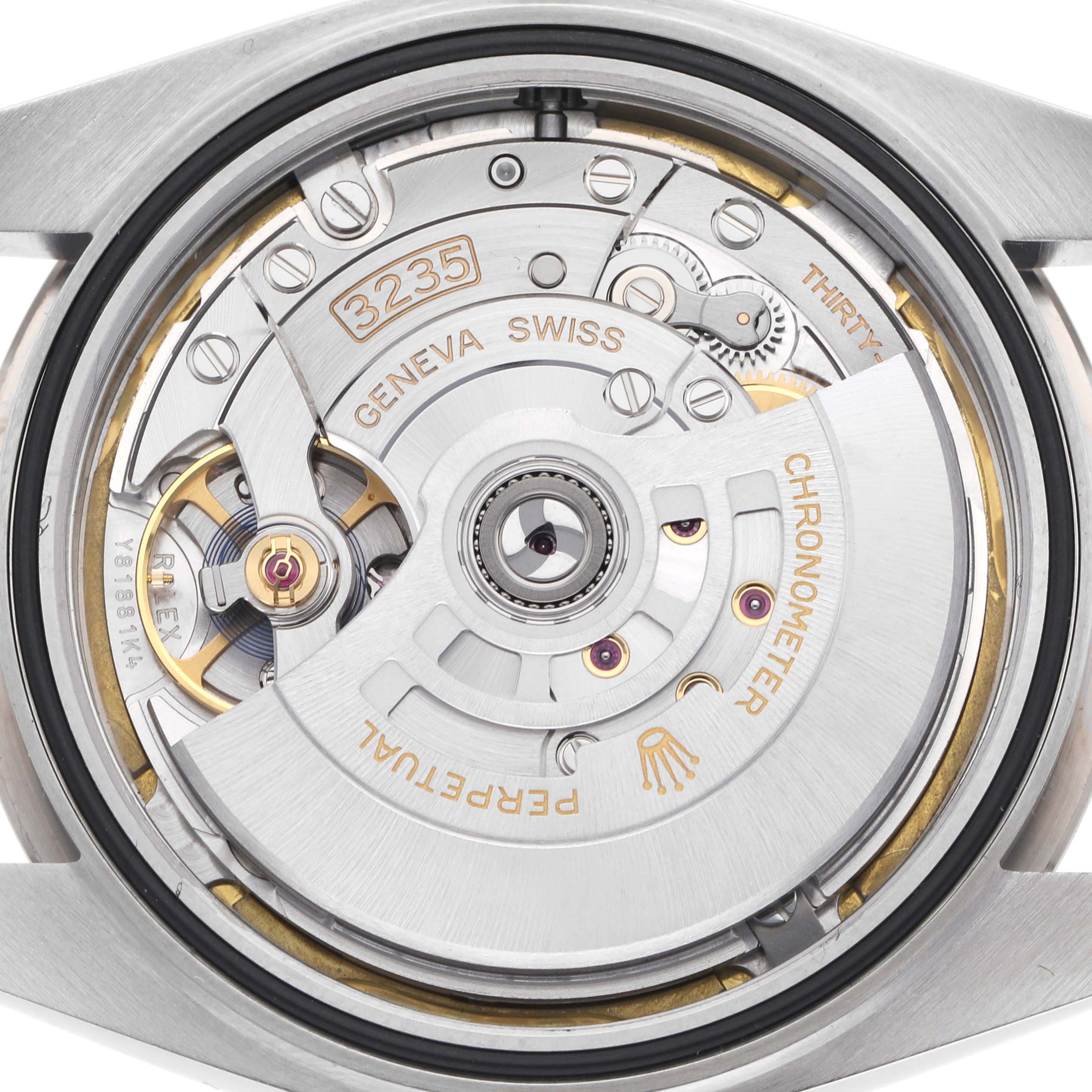 The image shows the movement of a Rolex Datejust 41 126334 Men
s Stainless Steel White Dial 126334 Men
s Stainless Steel White Dial, viewed from the back, focusing on its intricate mechanical components.
