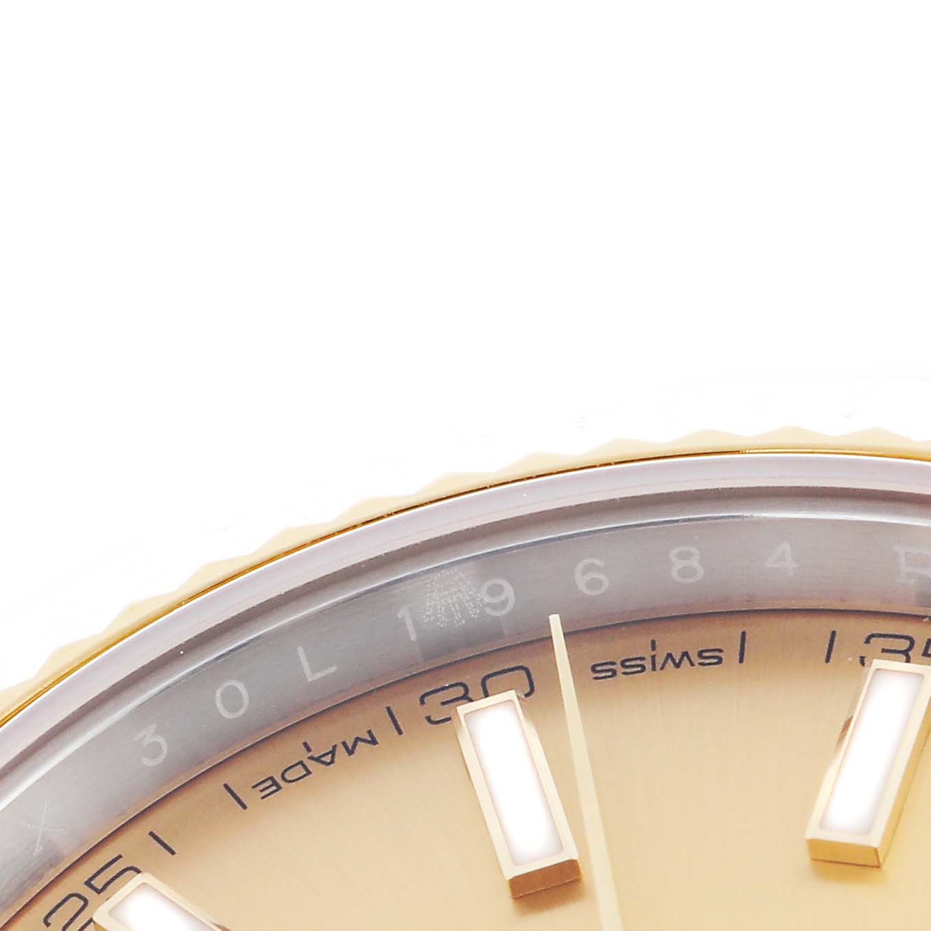 The image shows a close-up of the dial and fluted bezel of the Rolex Datejust 41 126333 Men
s Steel and Gold (two tone) Champagne Dial 126333 Men
s Steel and Gold (two tone) Champagne Dial, highlighting the hour markers and minute indicators.