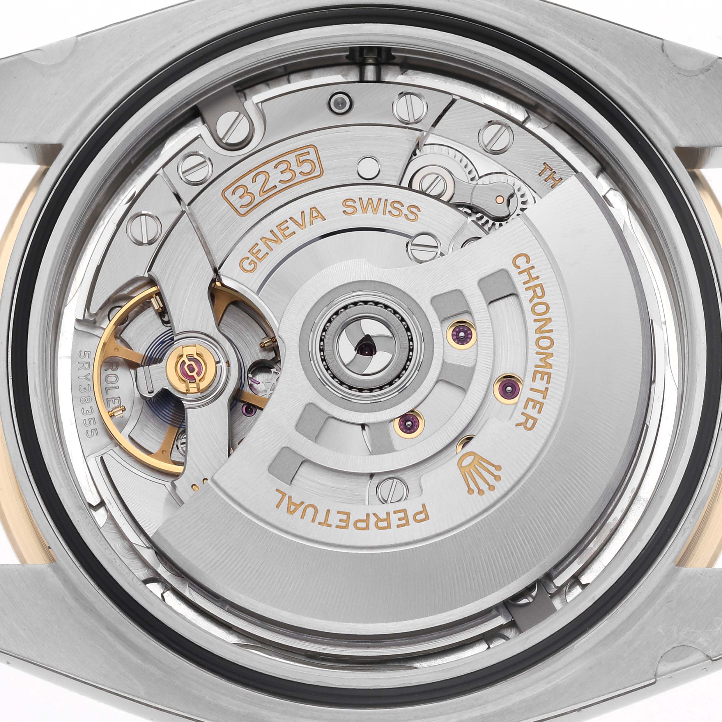 The image shows the Rolex Datejust 41 126333 Men
s Steel and Gold (two tone) Silver Dial 126333 Men
s Steel and Gold (two tone) Silver Dial
s movement from the back, highlighting the intricate gears and rotor.