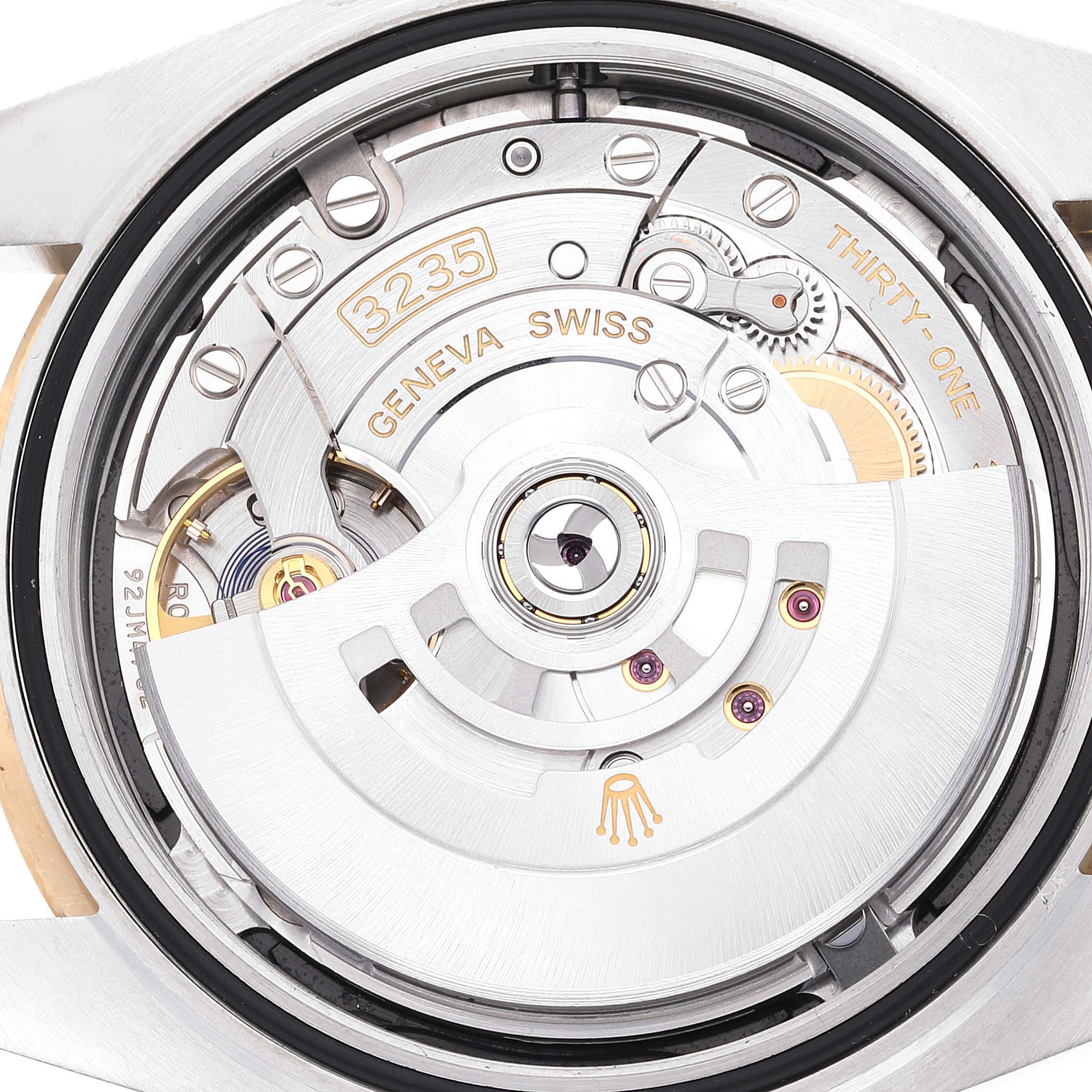 This is a close-up view of the movement inside a Rolex Datejust 41 126303 Men
s Steel and Gold (two tone) Black Dial 126303 Men
s Steel and Gold (two tone) Black Dial watch, showcasing the intricate mechanics and engravings.