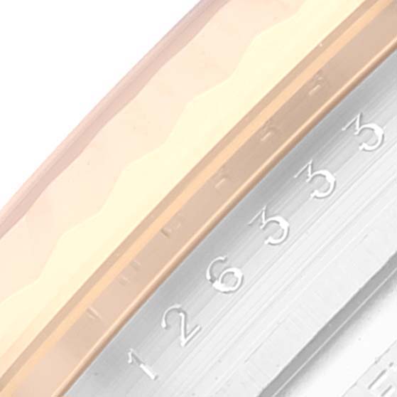 This close-up image features part of the bezel and the numbered date dial of a Rolex Datejust 41 126333 Men's Steel and Gold (two tone) Black Dial 126333 Men's Steel and Gold (two tone) Black Dial watch.