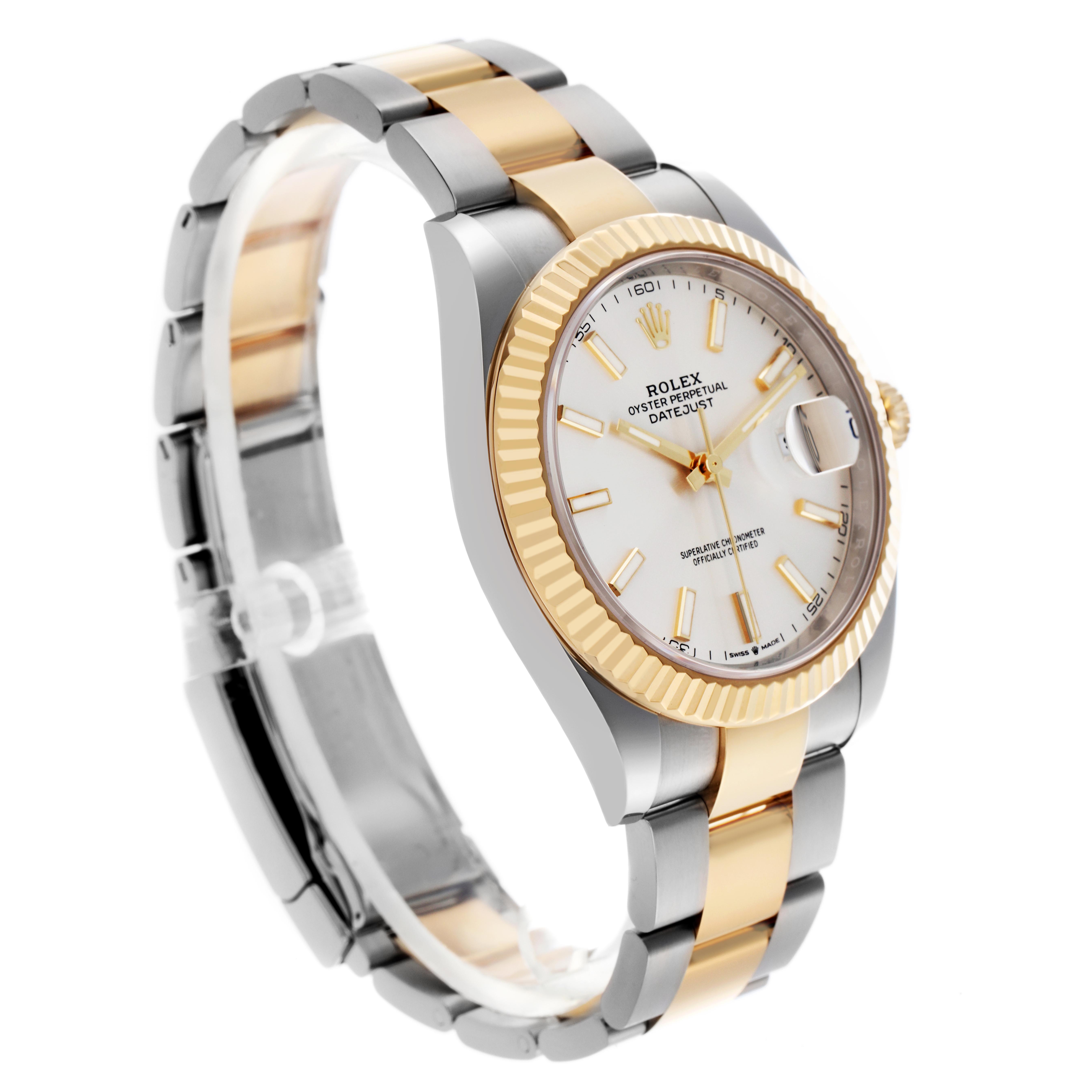 The Rolex Datejust 41 126333 Men
s Steel and Gold (two tone) Silver Dial 126333 Men
s Steel and Gold (two tone) Silver Dial watch is shown at a three-quarter angle, highlighting the face, fluted bezel, and two-tone bracelet.