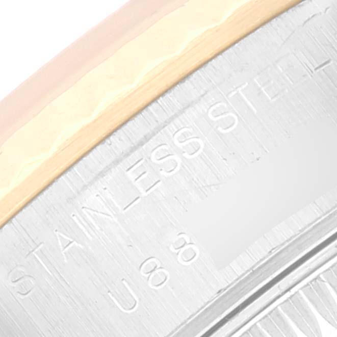 The image shows a close-up of the case engraving on a Rolex Datejust 69173 Women's Steel and Gold (two tone) Blue Dial 69173 Women's Steel and Gold (two tone) Blue Dial watch, highlighting 'STAINLESS STEEL' and part of the serial number.