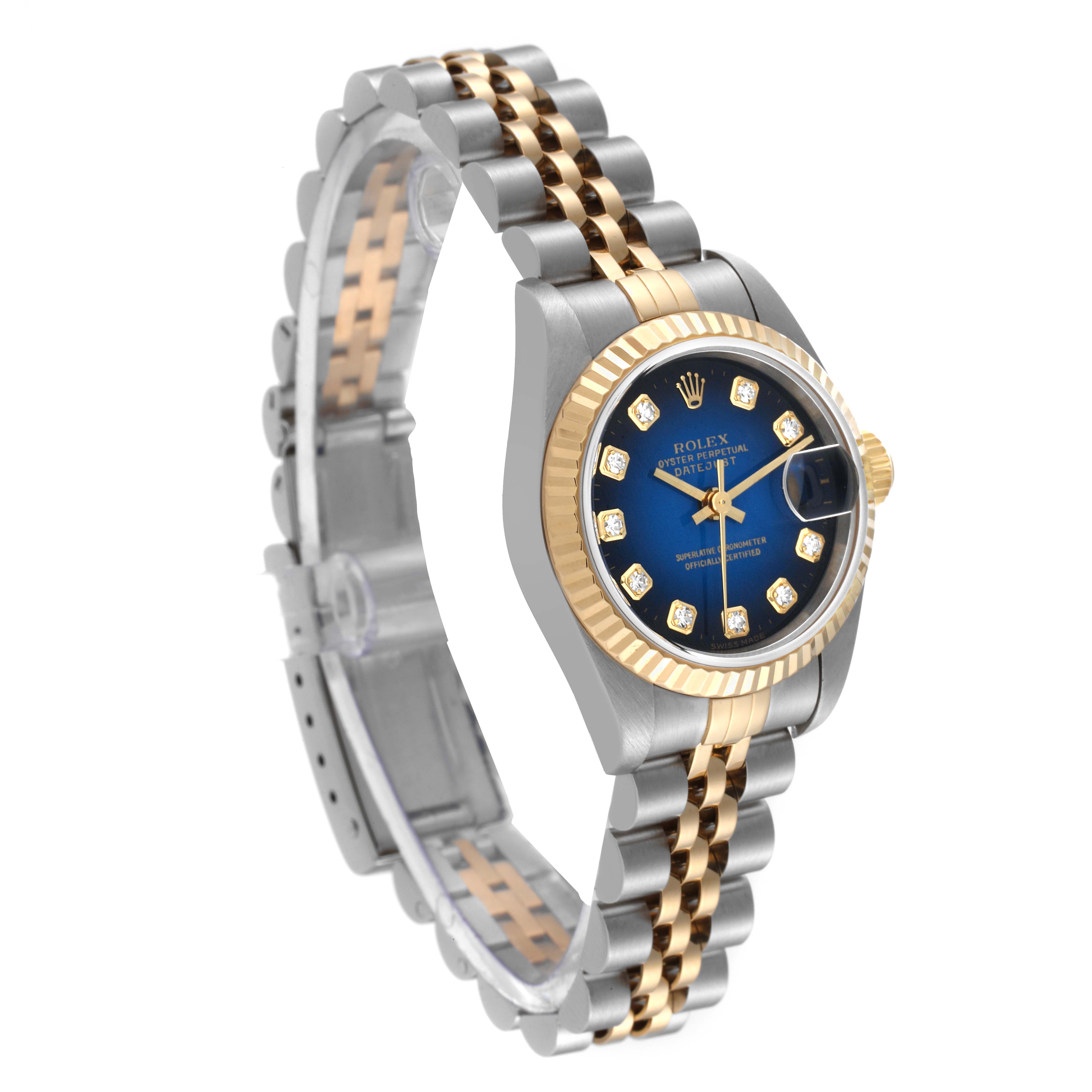 This Rolex Datejust 69173 Women's Steel and Gold (two tone) Blue Dial 69173 Women's Steel and Gold (two tone) Blue Dial watch is shown at a 3/4 angle, highlighting its blue dial, diamond hour markers, and two-tone band.