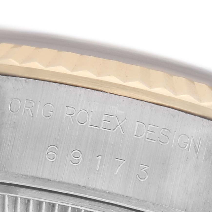 The image shows a close-up of the side engraving on the bezel of a Rolex Datejust 69173 Women
s Steel and Gold (two tone) Blue Dial 69173 Women
s Steel and Gold (two tone) Blue Dial, highlighting the model number.