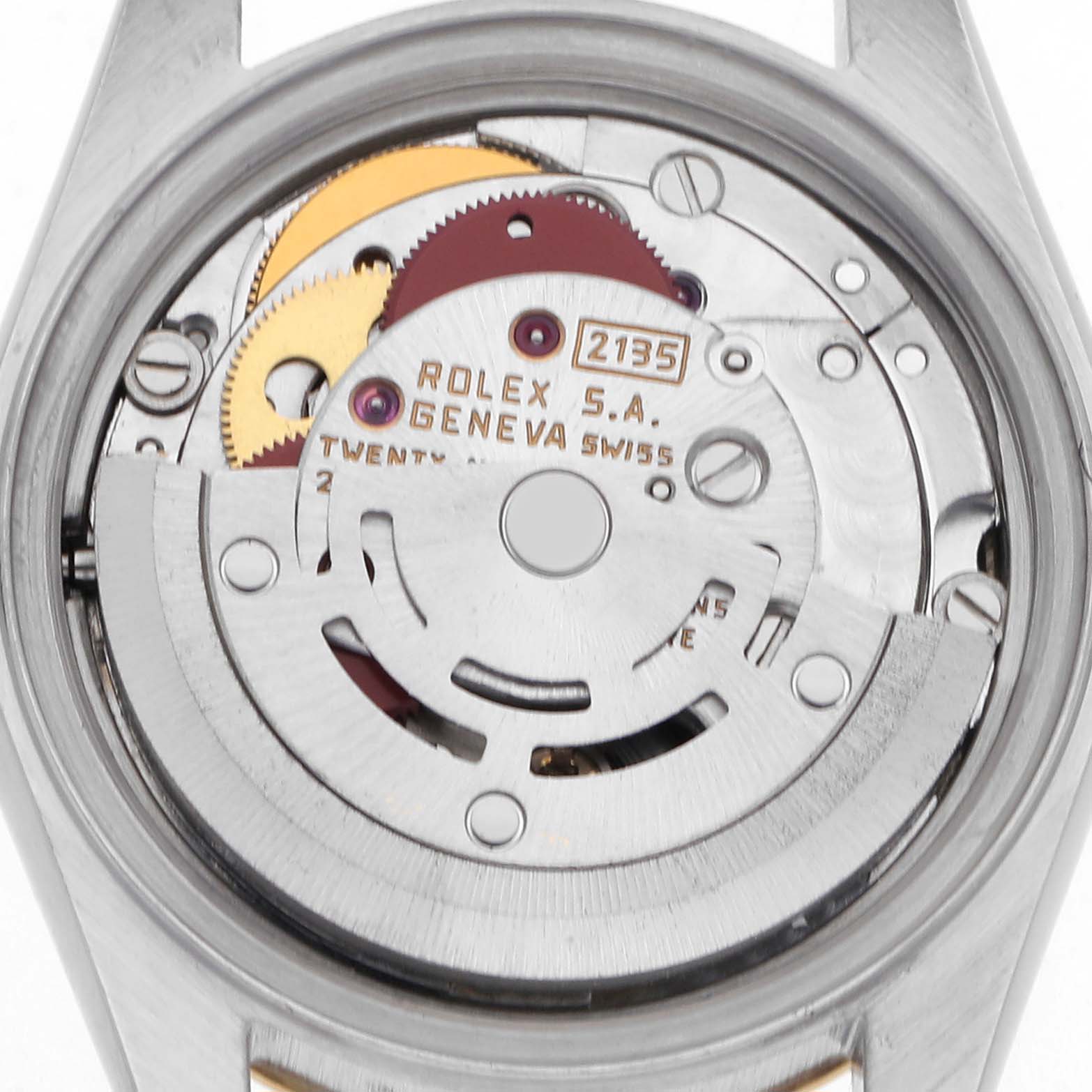 The image shows the movement of a Rolex Datejust 69173 Women
s Steel and Gold (two tone) Champagne Dial 69173 Women
s Steel and Gold (two tone) Champagne Dial watch from the back, revealing gears and inner mechanics.