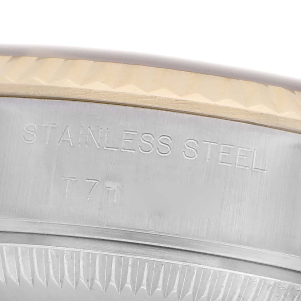 The image shows a close-up of the side and back of a Rolex Datejust 69173 Women's Steel and Gold (two tone) Champagne Dial 69173 Women's Steel and Gold (two tone) Champagne Dial, highlighting the stainless steel and part of the fluted bezel.