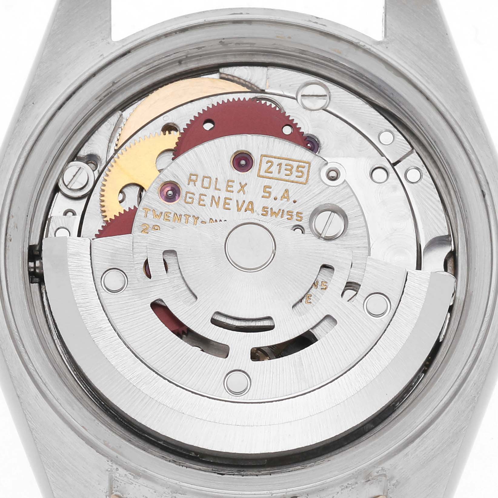 The image shows the movement of a Rolex Datejust 69173 Women
s Steel and Gold (two tone) Champagne Dial 69173 Women
s Steel and Gold (two tone) Champagne Dial, viewed from the back, highlighting gears and the rotor assembly.