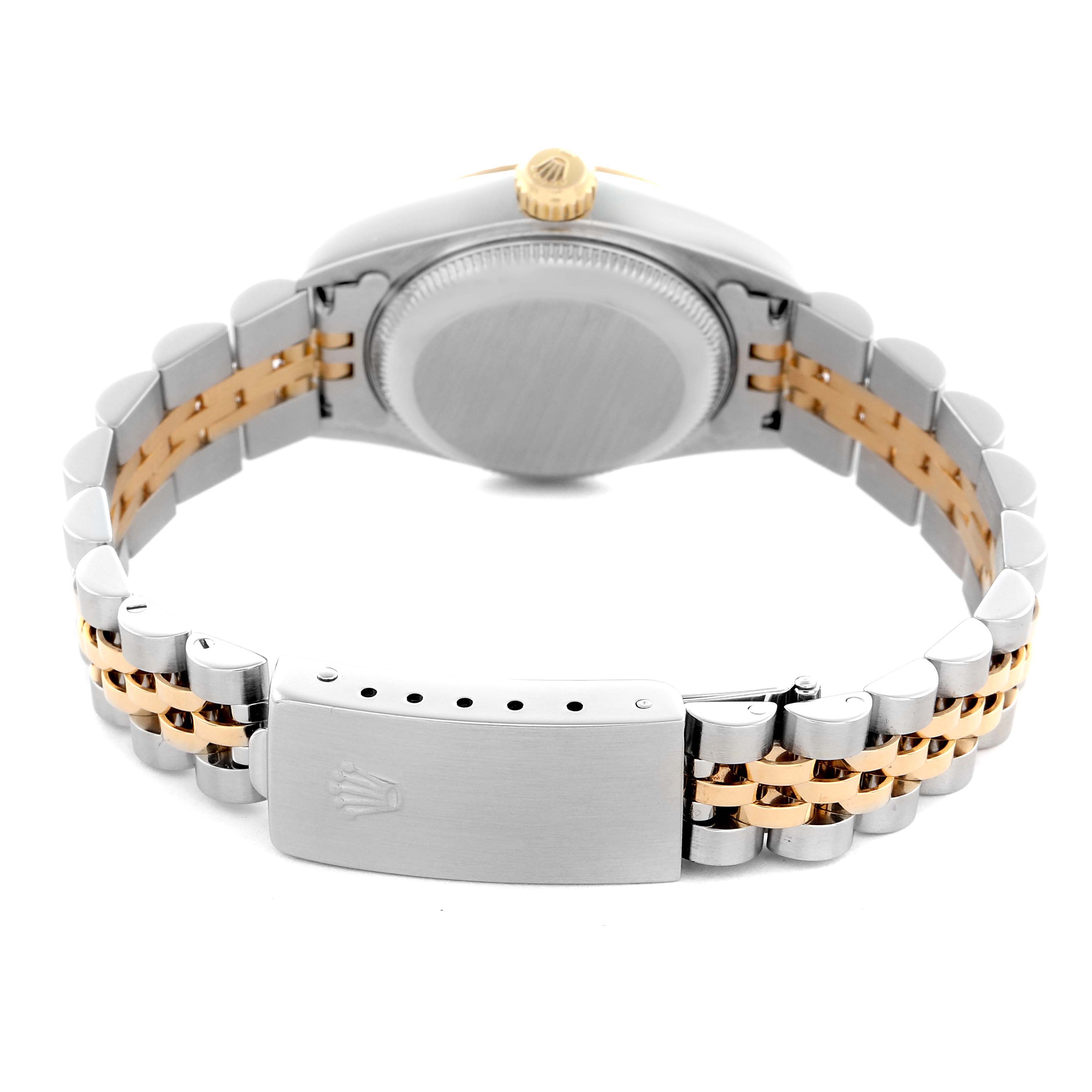 The image shows a back view of a Rolex Datejust 79173 Women
s Steel and Gold (two tone) Champagne Dial 79173 Women
s Steel and Gold (two tone) Champagne Dial watch, highlighting the case back, crown, and two-tone jubilee bracelet.
