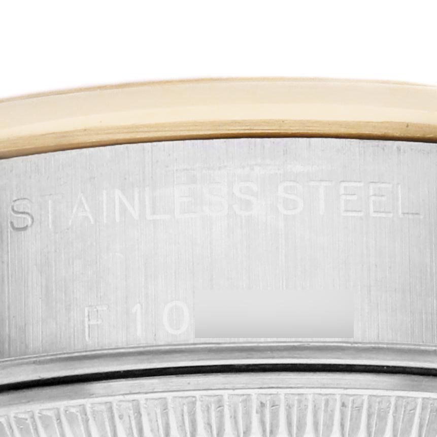 The image shows a close-up of the side of a Rolex Datejust 79163 Women's Steel and Gold (two tone) Grey Dial 79163 Women's Steel and Gold (two tone) Grey Dial case, highlighting the stainless steel and a portion of the fluted bezel.