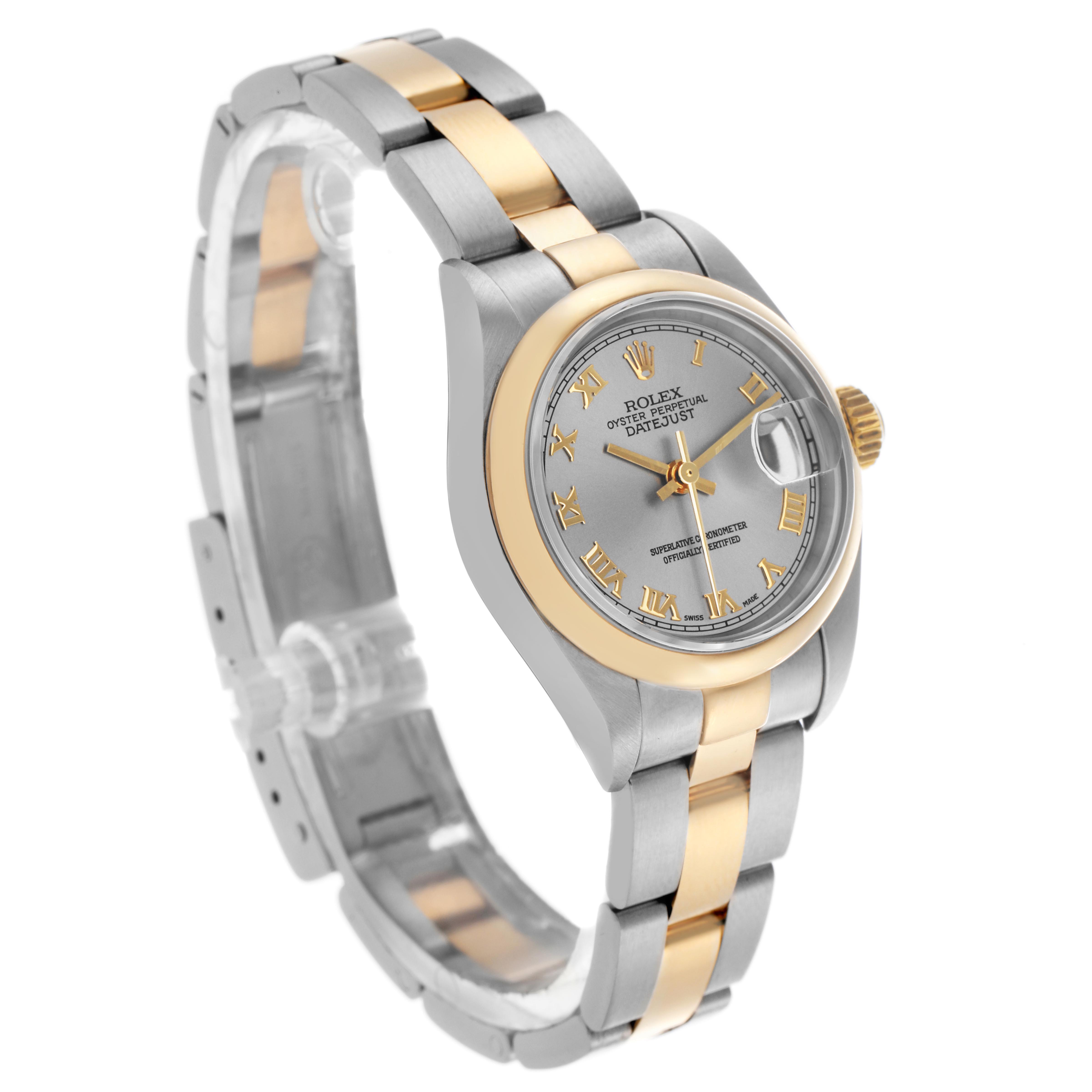 The Rolex Datejust 79163 Women's Steel and Gold (two tone) Grey Dial 79163 Women's Steel and Gold (two tone) Grey Dial watch is shown at a three-quarter angle, highlighting the face, bezel, crown, and two-tone bracelet.