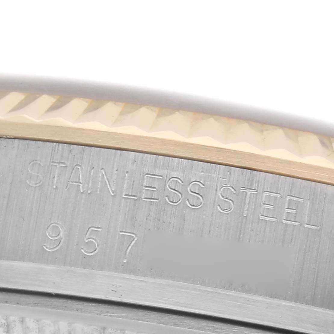 The image shows a close-up of the Rolex Datejust 16013 Men
s Steel and Gold (two tone) Champagne Dial 16013 Men
s Steel and Gold (two tone) Champagne Dial
s case back, highlighting the stainless steel and model number engraving.