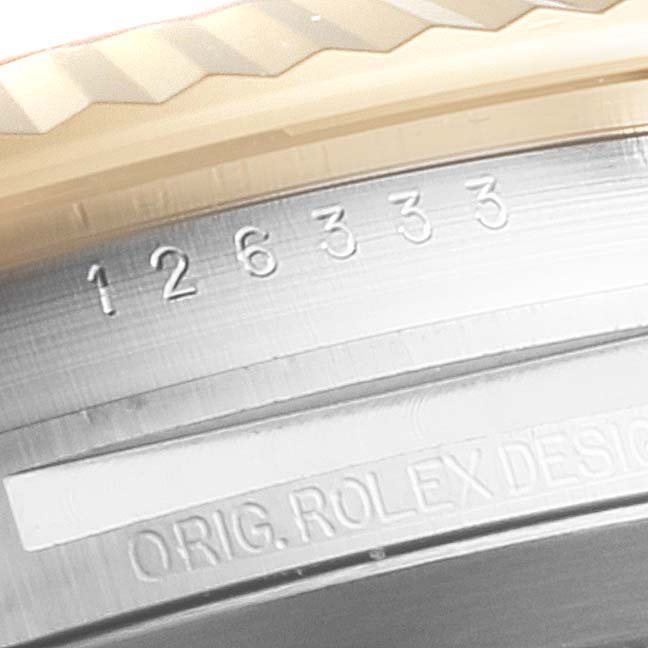This close-up image of the Datejust 41 by Rolex shows the model number and part of the fluted bezel.