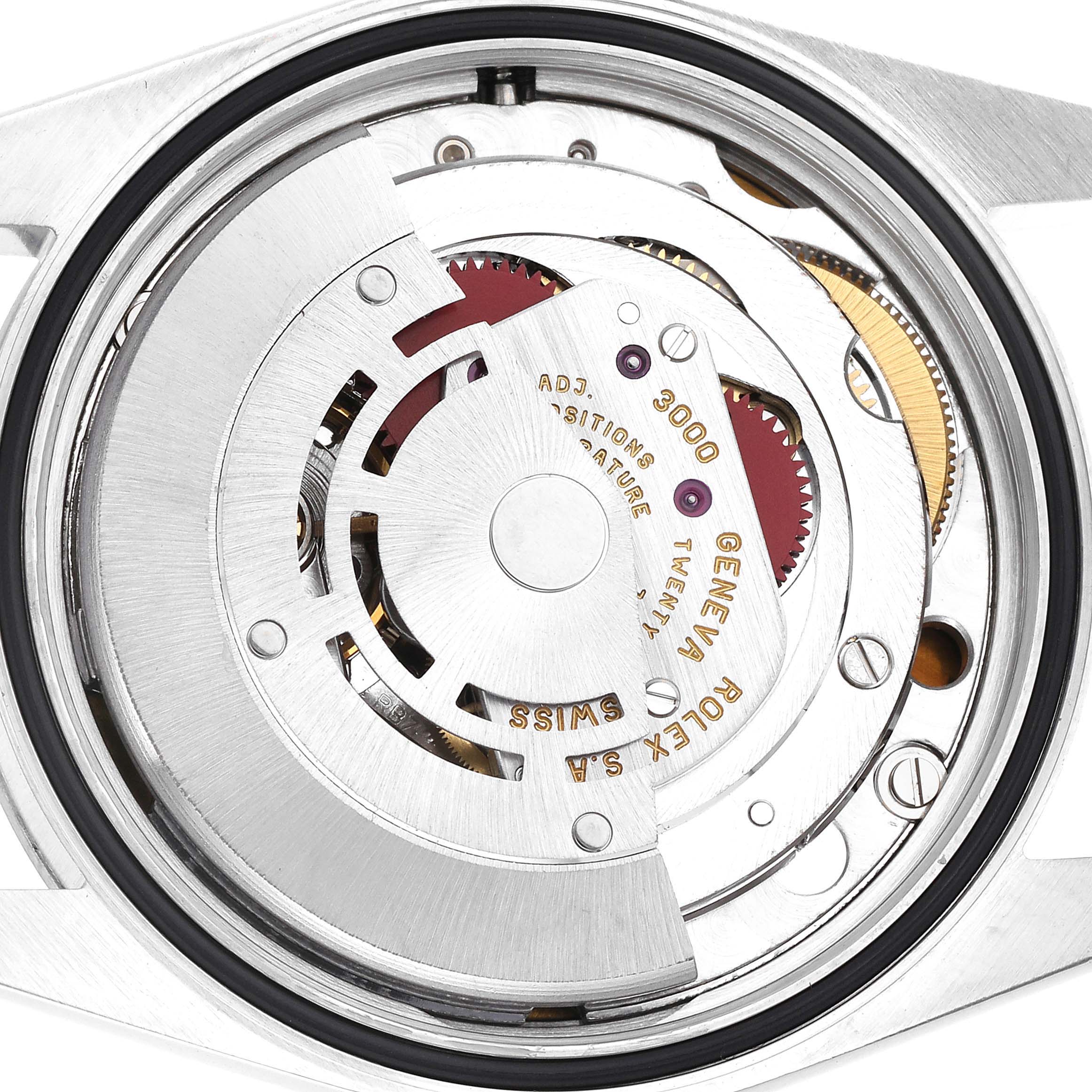 The image shows the movement of the Rolex Explorer 14270 Men
s Stainless Steel Black Dial 14270 Men
s Stainless Steel Black Dial, viewed from the back, highlighting gears and inscriptions.