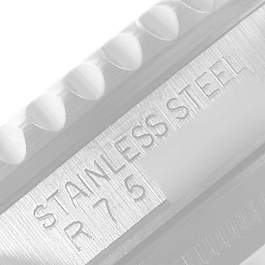 This image shows a close-up of the case side of a Rolex GMT-Master 16700 Men's Stainless Steel Black Dial 16700 Men's Stainless Steel Black Dial, highlighting the "STAINLESS STEEL" and serial number.