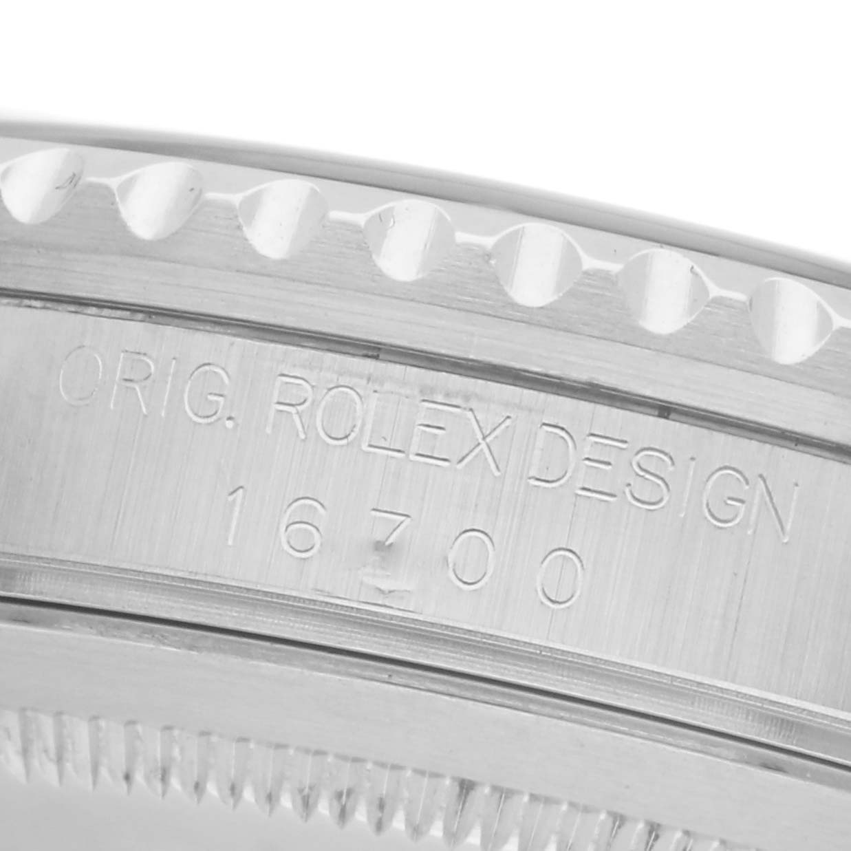 The image shows the side view of a Rolex GMT-Master 16700 Men
s Stainless Steel Black Dial 16700 Men
s Stainless Steel Black Dial watch case, featuring the engraved model number "16700."