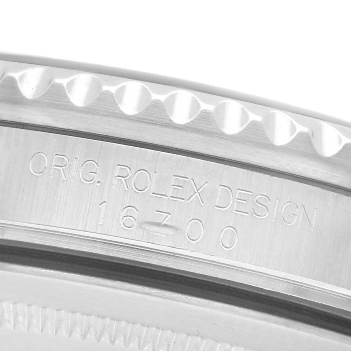 The image shows a close-up of the side bezel and engraving on the Rolex GMT-Master 16700 Men
s Stainless Steel Black Dial 16700 Men
s Stainless Steel Black Dial, displaying a portion of the case design.