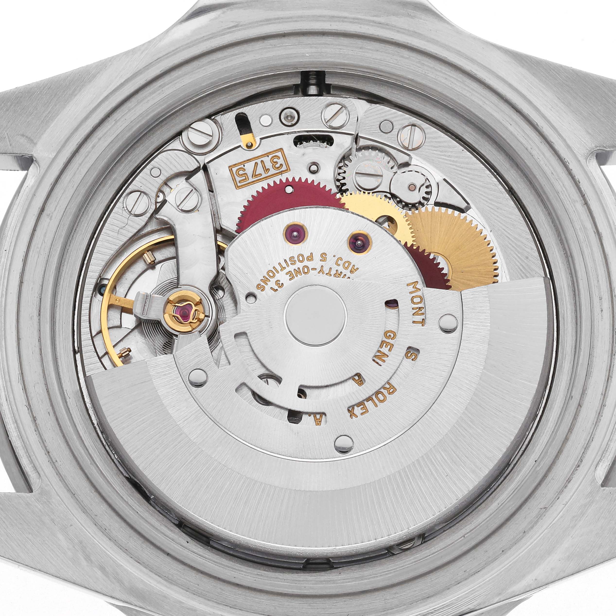 The image shows the movement of a Rolex GMT-Master 16700 Men
s Stainless Steel Black Dial 16700 Men
s Stainless Steel Black Dial watch from a top-down angle, highlighting gears and components.