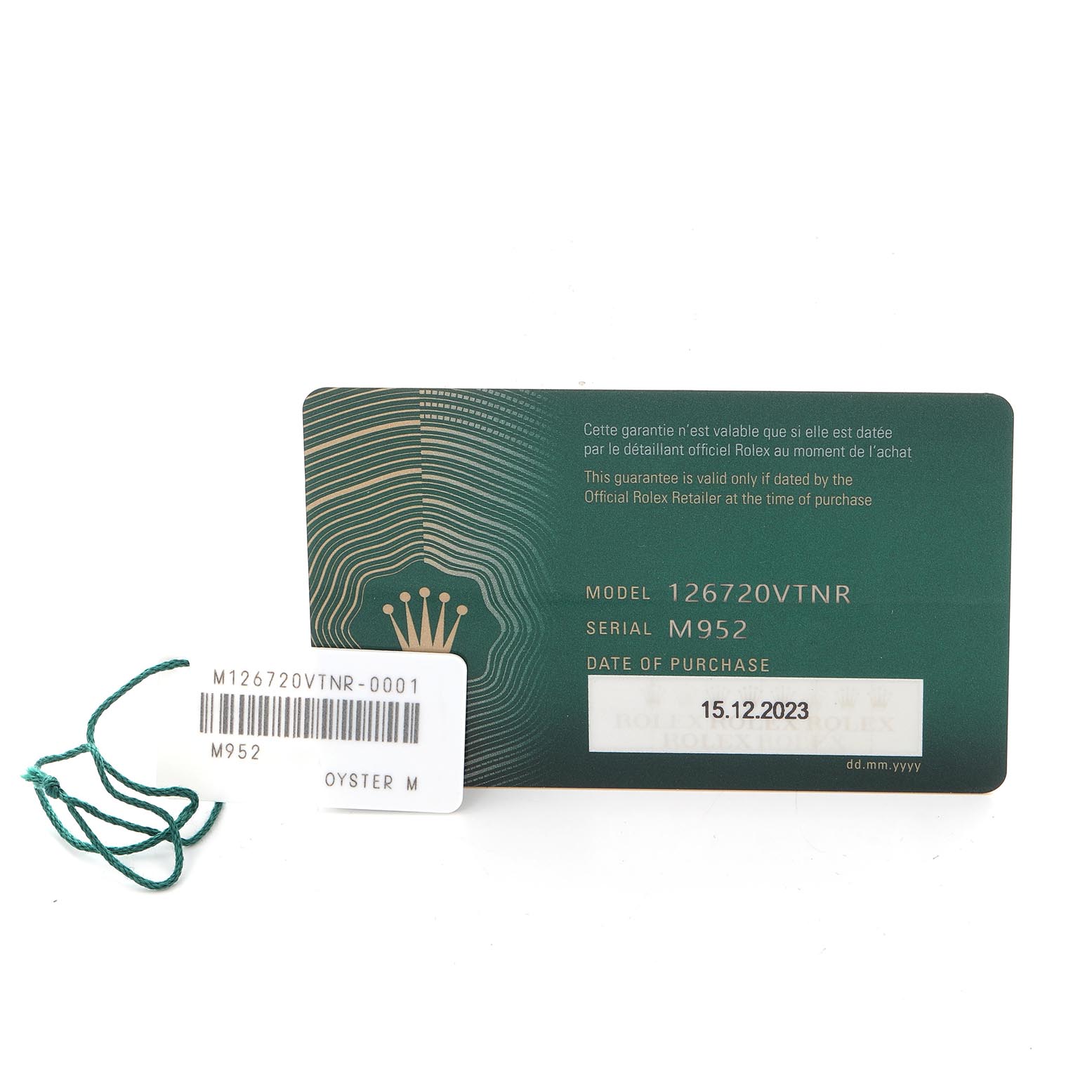 The image shows a Rolex GMT-Master 126720VTNR Men
s Stainless Steel Black Dial 126720VTNR Men
s Stainless Steel Black Dial model warranty card and a tag with model and serial numbers.