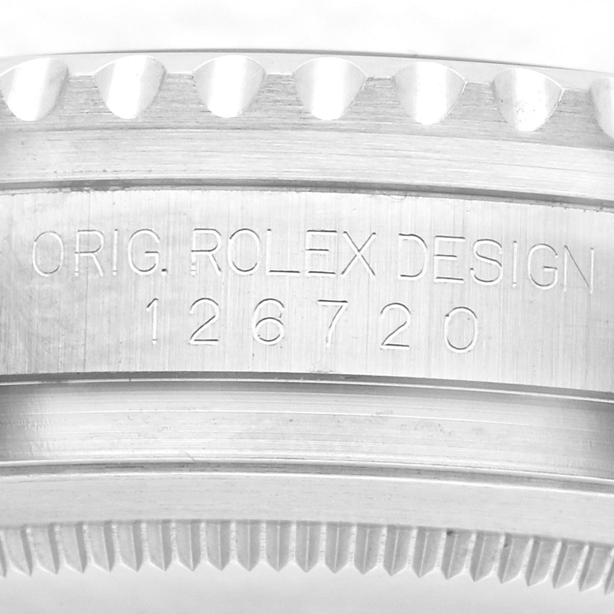 The image shows the side of the case and bezel of a Rolex GMT-Master 126720VTNR Men
s Stainless Steel Black Dial 126720VTNR Men
s Stainless Steel Black Dial, showcasing its engraved model number.