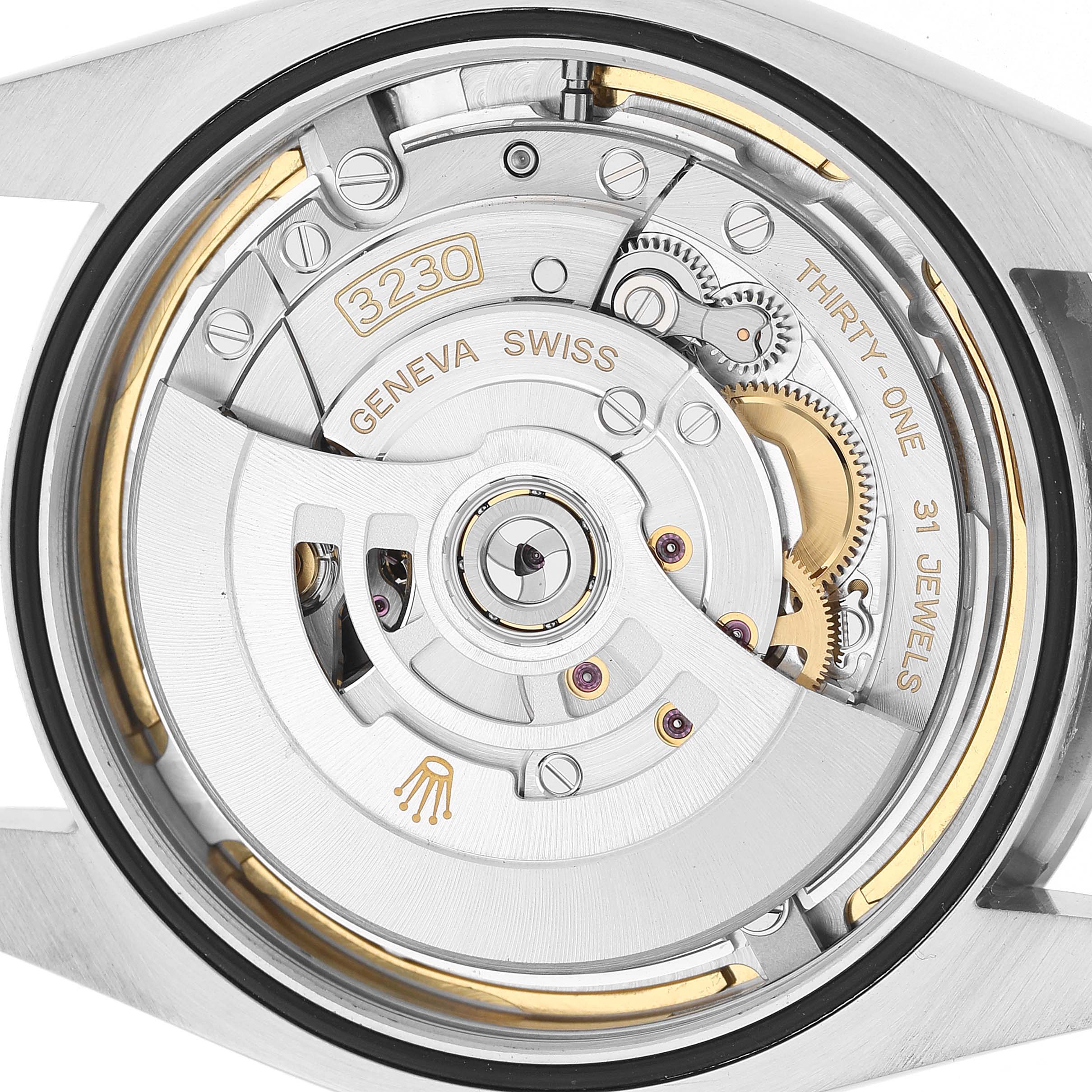 The image shows the movement mechanism of a Rolex Oyster Perpetual 124300 Men's Stainless Steel Blue Dial watch, viewed from the back.