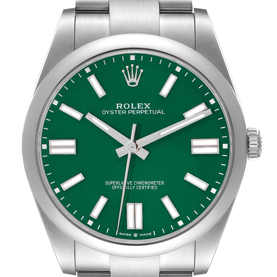 The Rolex Oyster Perpetual watch is shown from a front angle, highlighting its green dial, markers, and crown on the right.