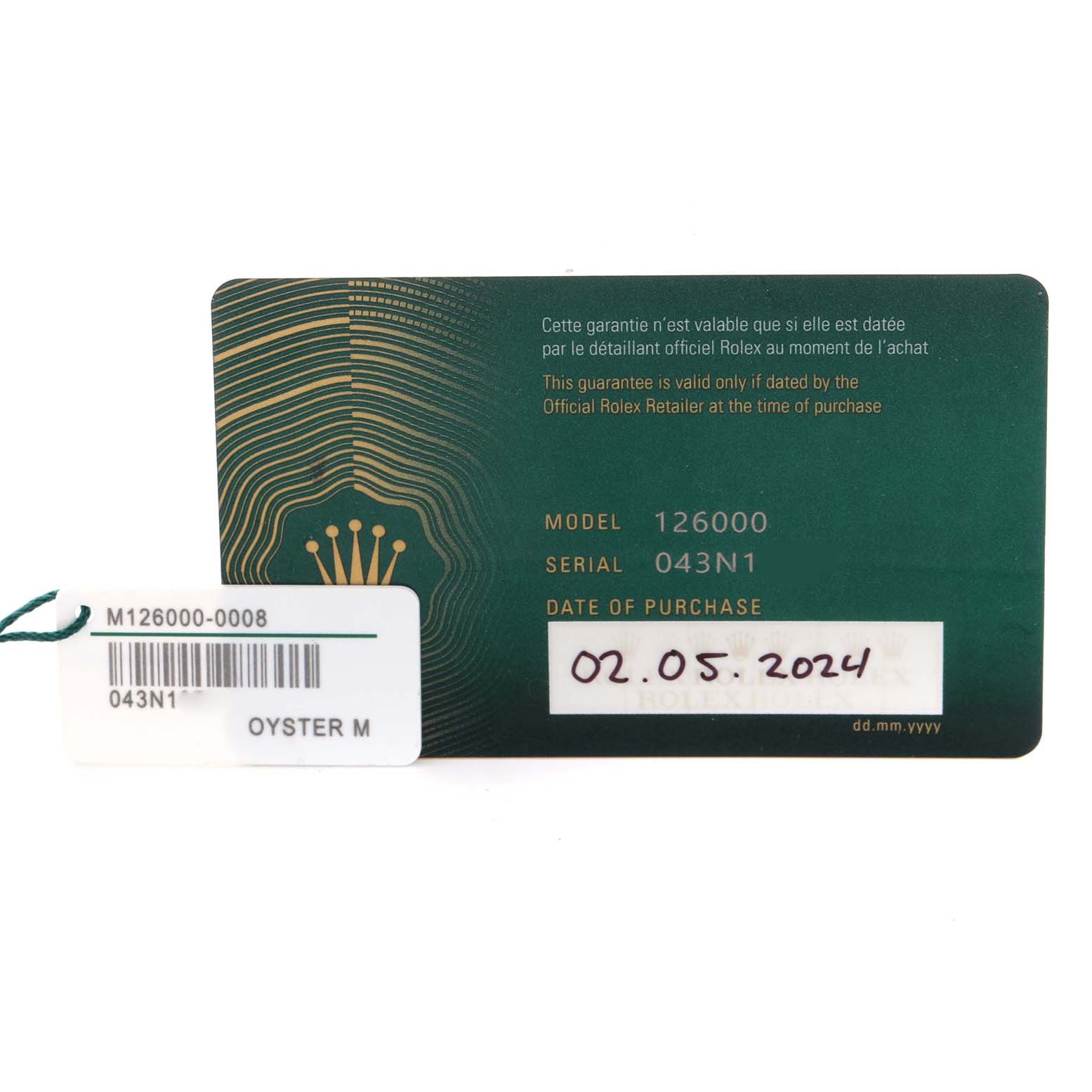 The image shows a warranty card and tag for a Rolex Oyster Perpetual 126000 Men
s Stainless Steel Pink Dial 126000 Men
s Stainless Steel Pink Dial model, including model and serial numbers.