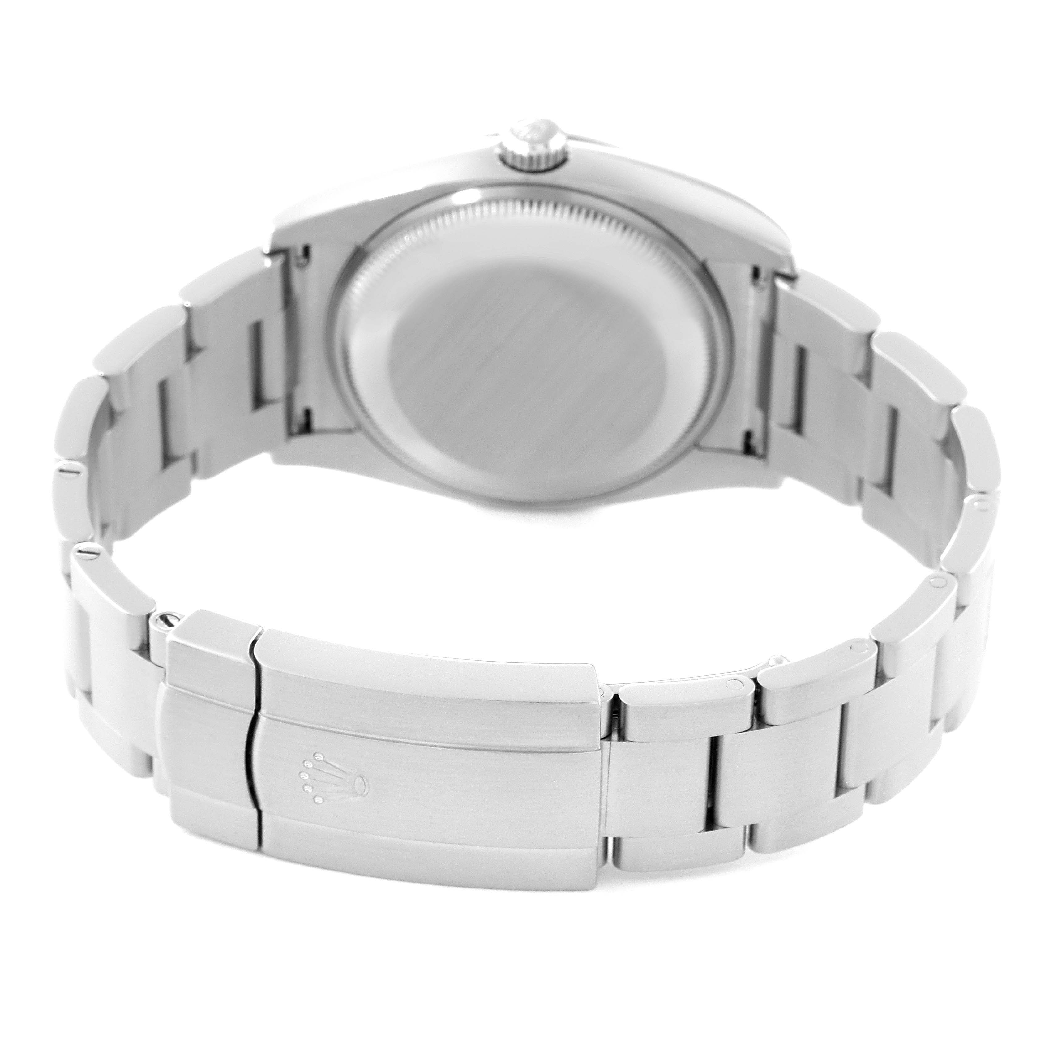 The image shows the back of a Rolex Oyster Perpetual 114200 Men's Stainless Steel Green Dial 114200 Men's Stainless Steel Green Dial watch, highlighting the case back and bracelet clasp.