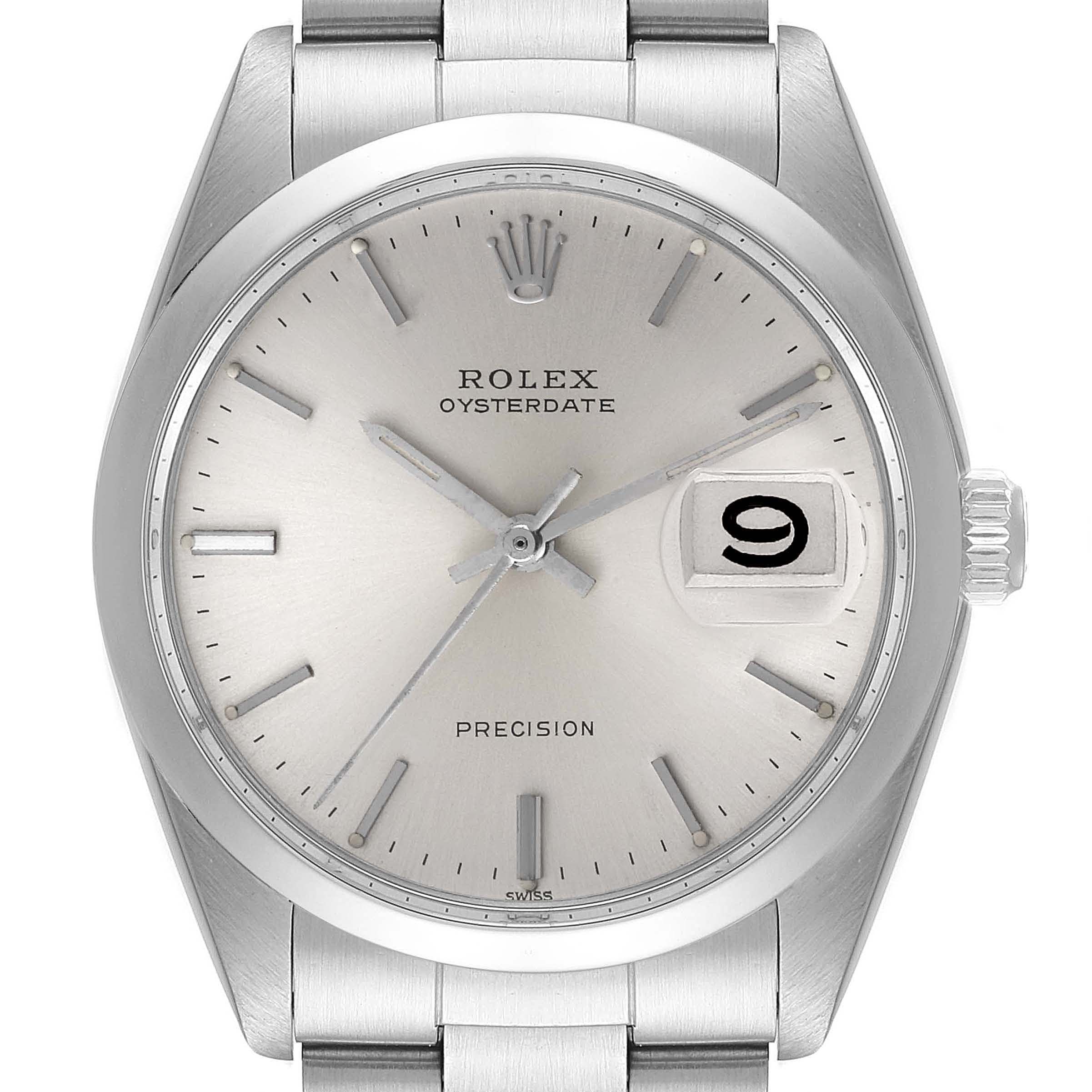 The image shows a front view of the Rolex Vintage Collection 6694 Men's Stainless Steel Silver Dial 6694 Men's Stainless Steel Silver Dial Oysterdate watch, highlighting the dial, date window, and stainless steel bracelet.